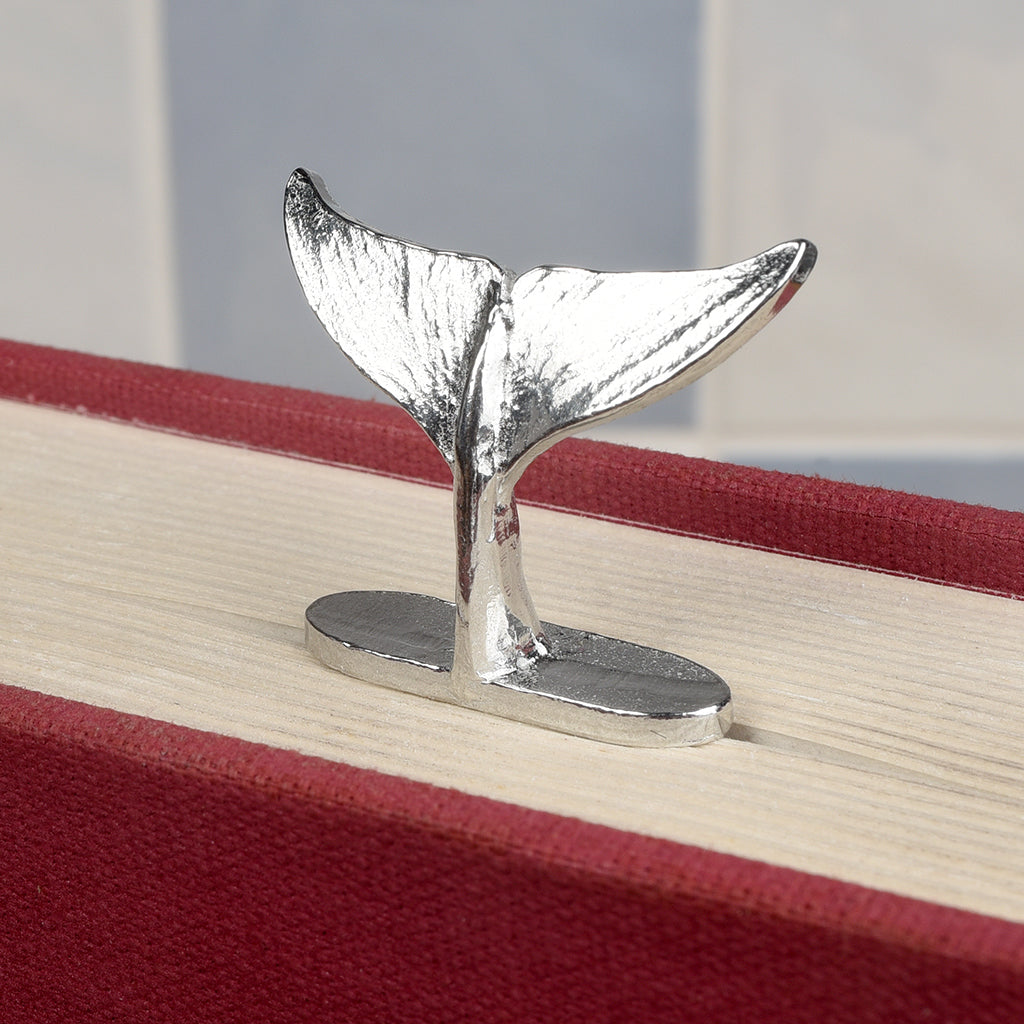 A personalised engraved pewter metal bookmark with a diving dolphin tail on the top. On the front the quotation 'Dive into a new chapter'. New chapter gifts, dolphin gifts, personalised gifts, new job gifts. We engrave the back with your message