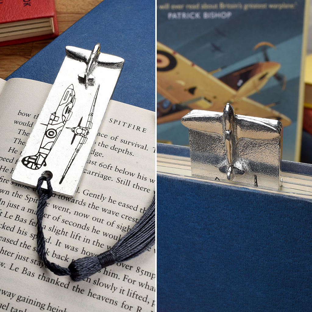 A  pewter metal  bookmark with a Spitfire aeroplane sculpture on the top. On the front are blueprint drawings of a mark IX Spitfire.