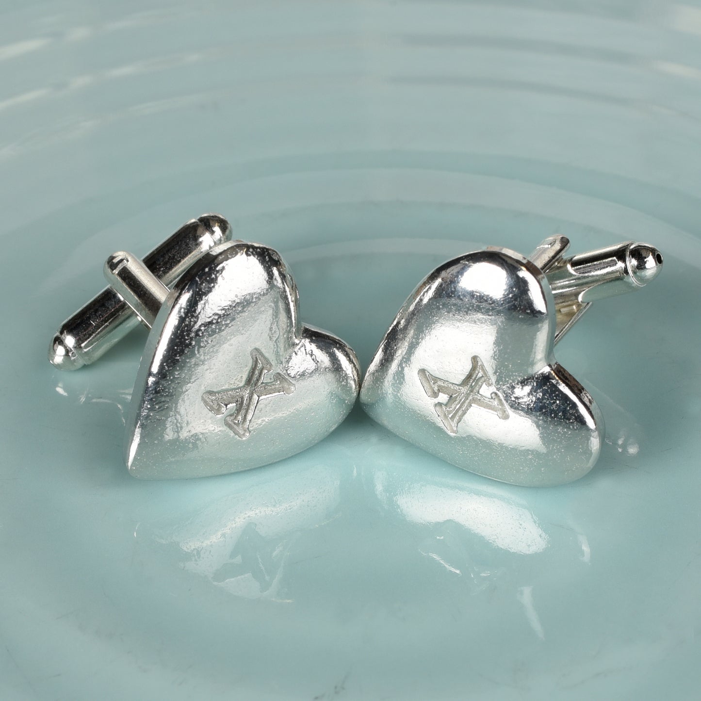 Stylish and elegant pewter heart cufflinks with a X (signifying 10) engraved onto the front on high quality silver plated cufflink fittings. UK made with love and care. The perfect 10 year anniversary gift for him - tin anniversary gifts and a great gift for Father's Day.