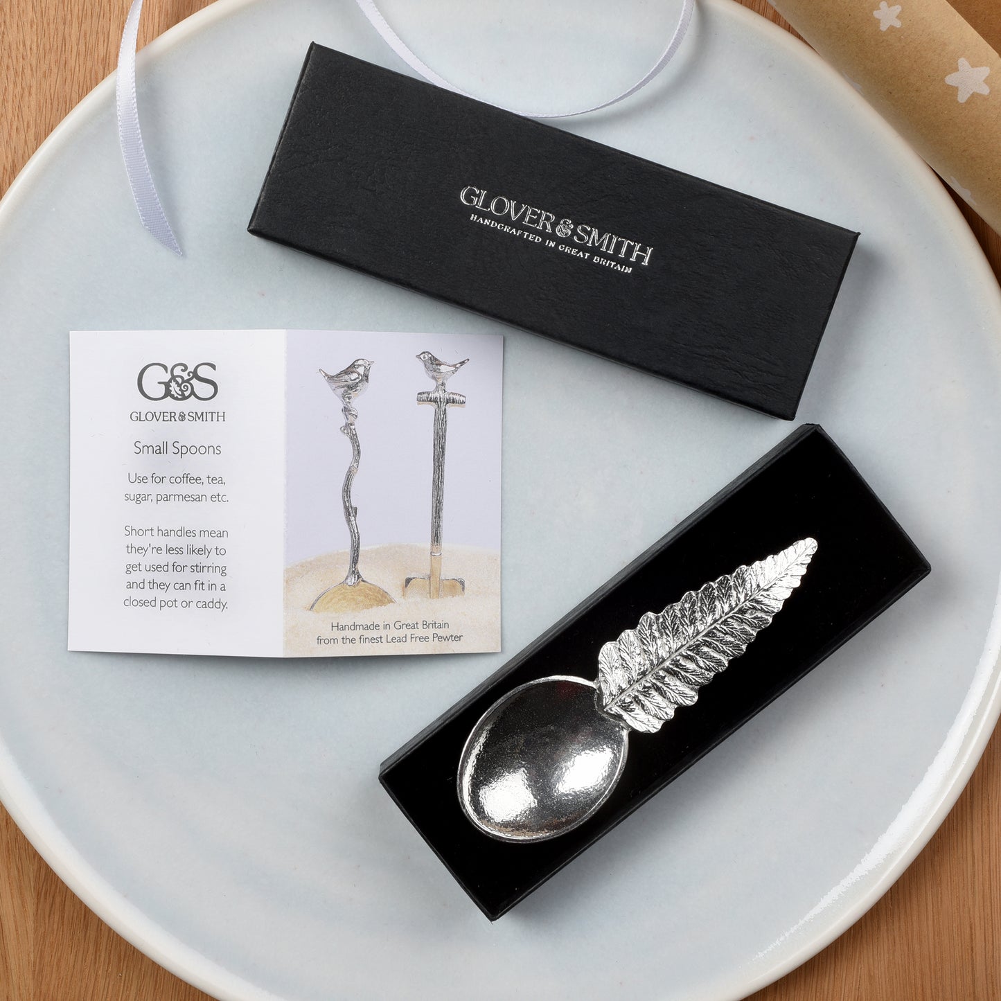 Pewter tea or coffee caddy spoon with a fern leaf handle and an oval spoon bowl. Contemporary modern pewter spoon