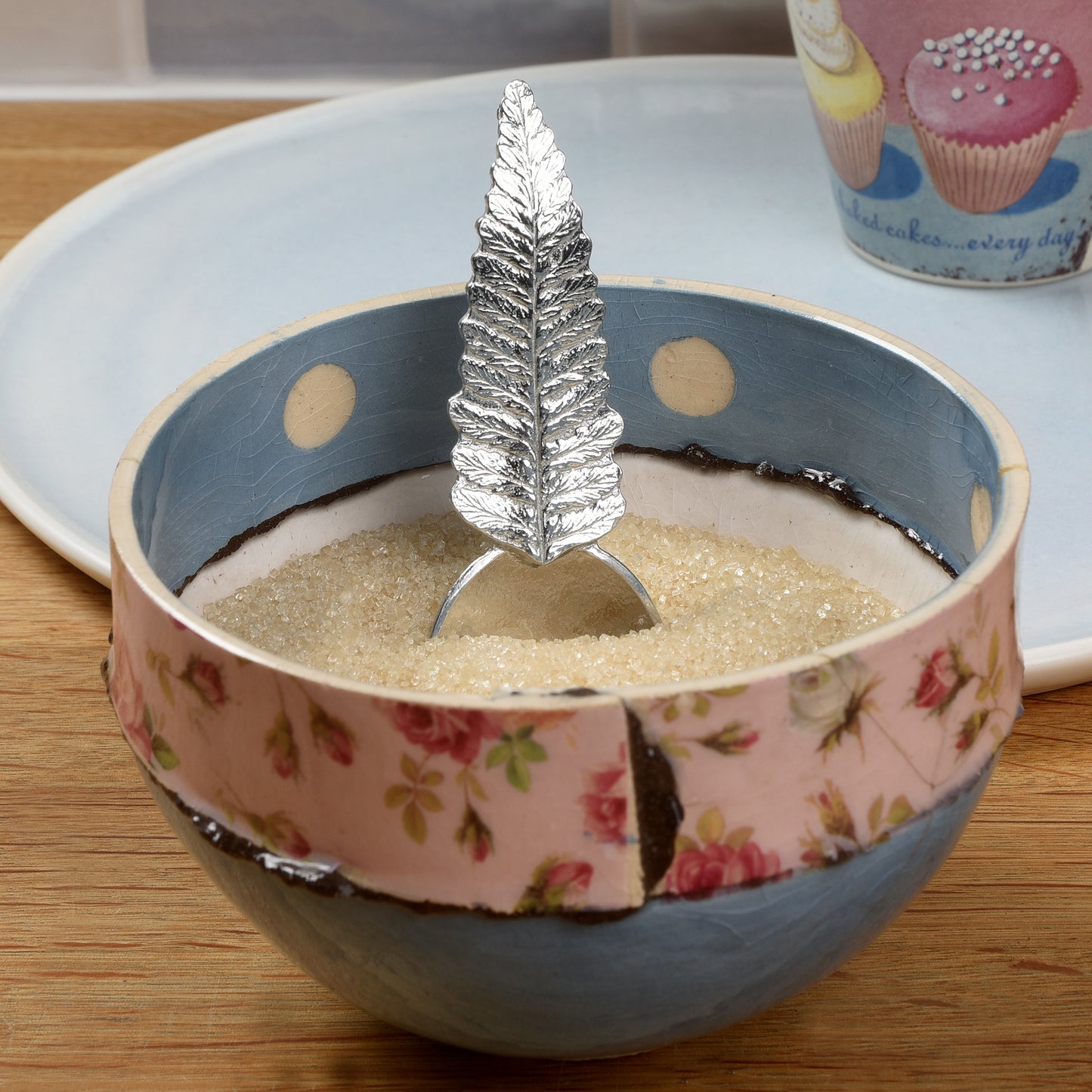 Pewter tea or coffee caddy spoon with a fern leaf handle and an oval spoon bowl. Contemporary modern pewter spoon