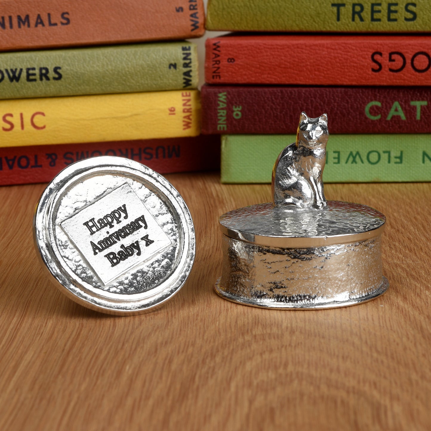Cat pewter personalised trinket box. Our round cat keepsake box features a cat sculpture as a handle. The underside of the lid can be engraved with your personalised message. Cat gifts, personalised gifts for cat lovers. Country gifts, made in Britain.