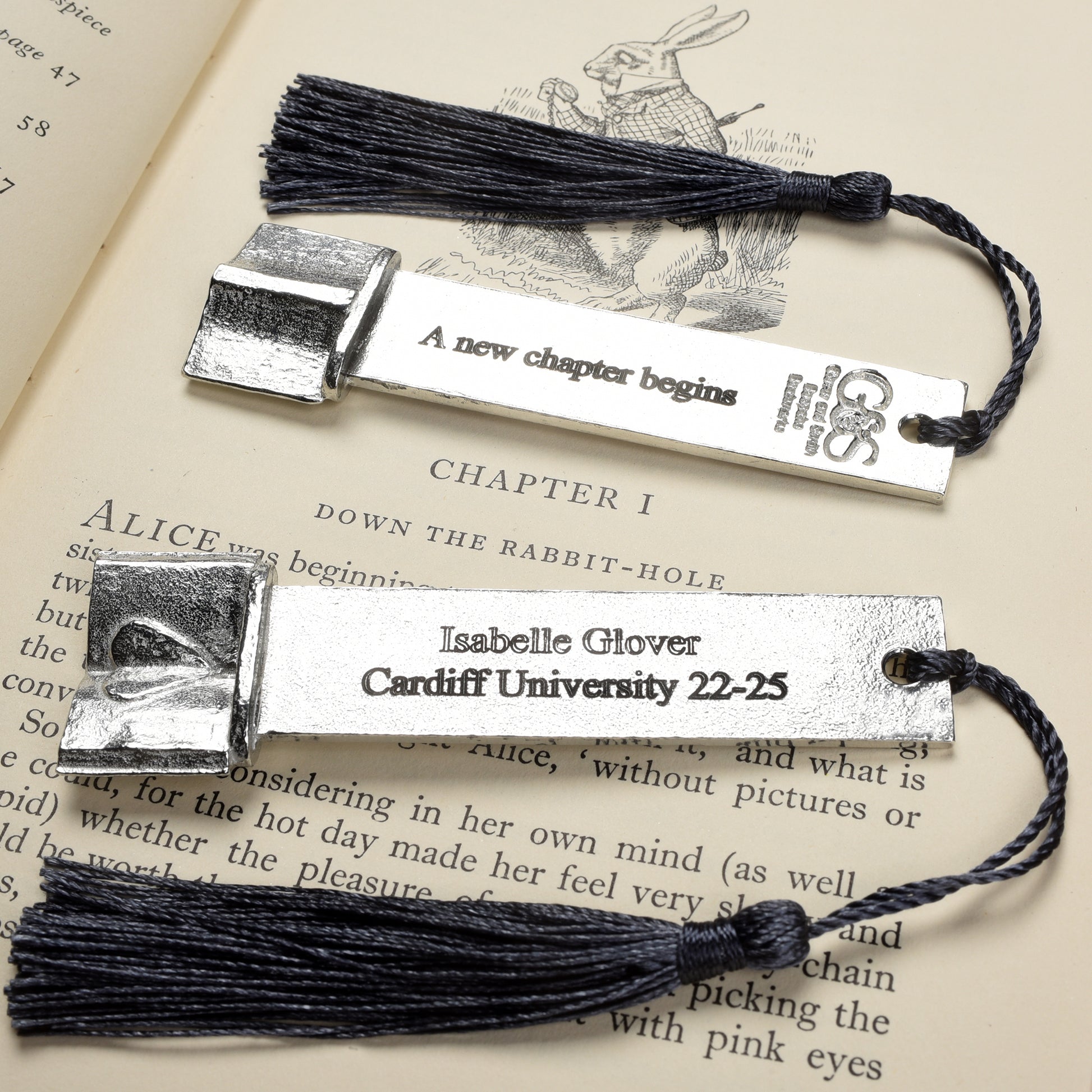 A personalised engraved pewter metal  bookmark with a heart on an open book on the top. We can engrave the front and the back with your own personalised messages. Unique gifts. Ideal 10th tin wedding anniversary gift. Our pewter is 95% tin.