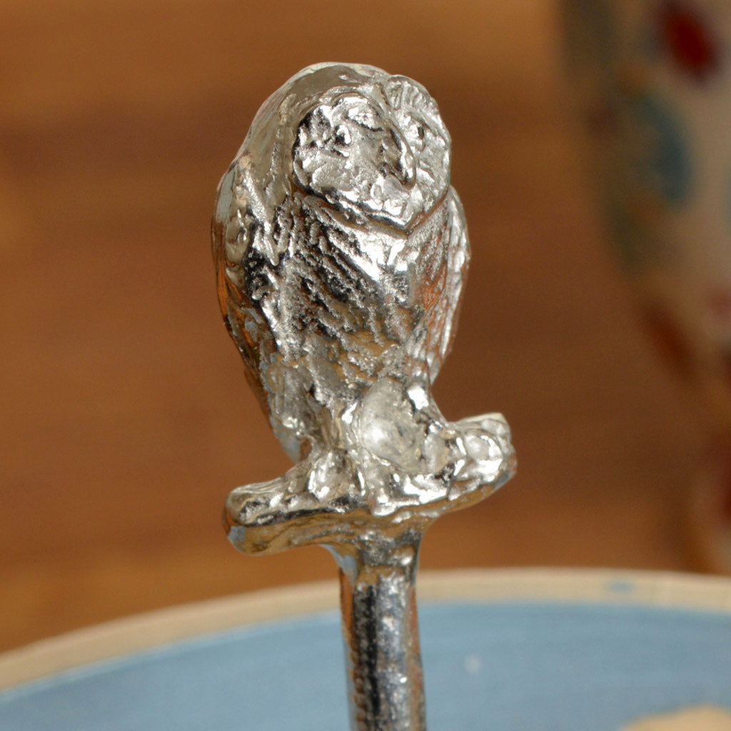 A small spoon pewter sugar spoon. A round bowled spoon on a straight handle leads to a perfectly sculpted owl. Practical & useful bird gifts for bird lovers. UK handmade