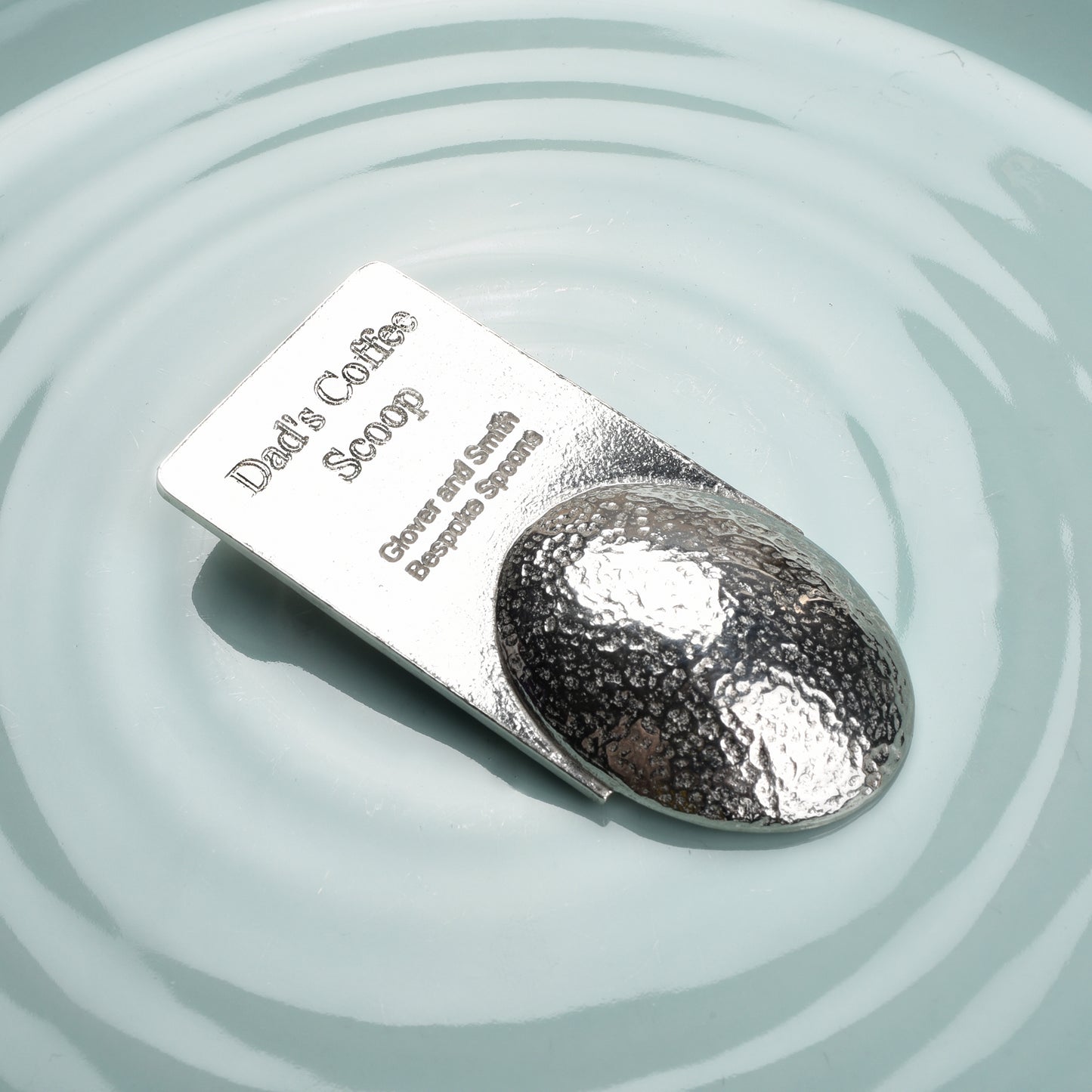A personalised Spitfire pewter coffee measure scoop spoon. We engrave the back of this contemporary coffee spoon with your own personal message, name or date. The spoon can also be used as a tea caddy spoon or a sugar spoon.