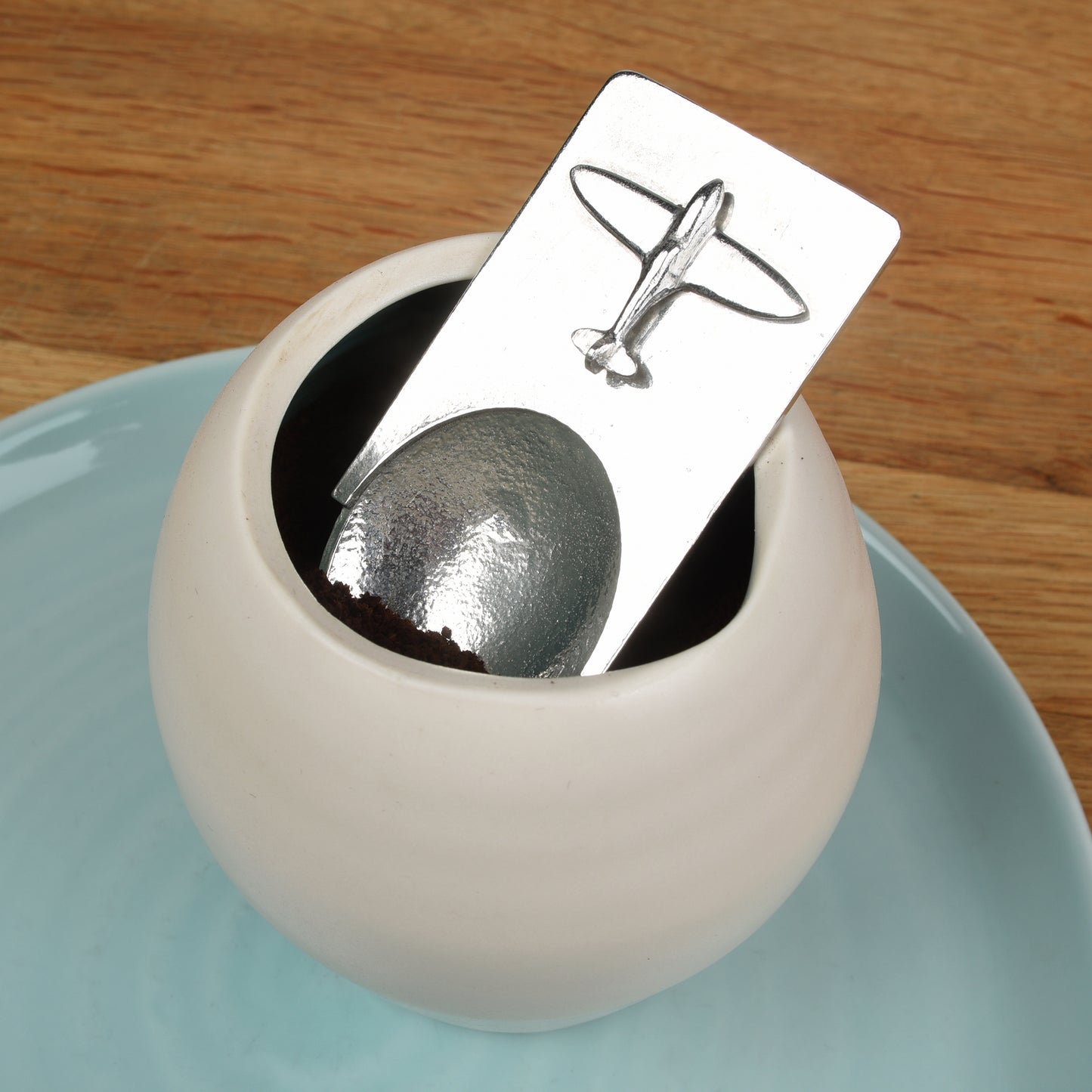 A personalised Spitfire pewter coffee measure scoop spoon. We engrave the back of this contemporary coffee spoon with your own personal message, name or date. The spoon can also be used as a tea caddy spoon or a sugar spoon.