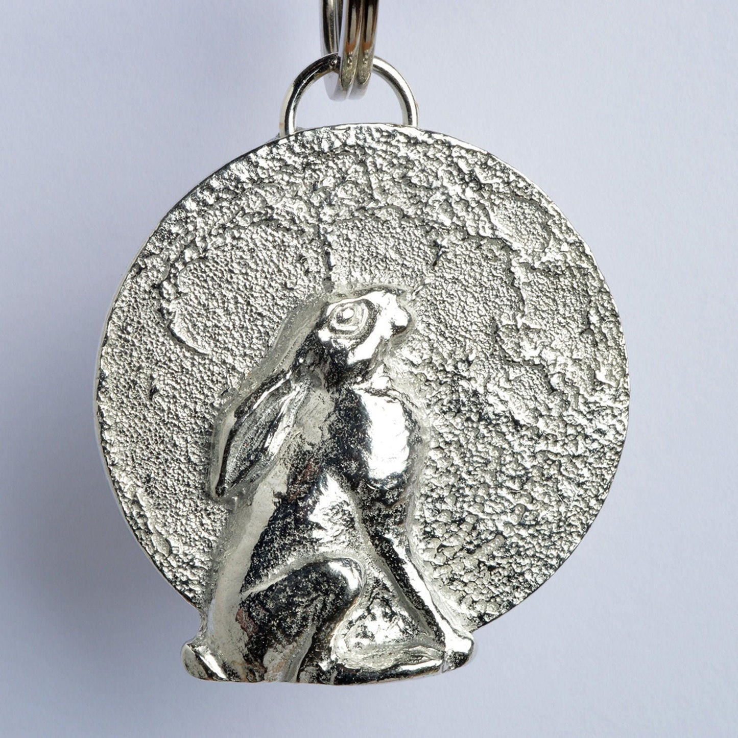 A hare gazes at a beautifully textured moon. Solid pewter hare keyring on a quality stainless steel ring. Hare gifts, gifts for hare lovers, Pewter keyring gifts. Housewarming gifts, moon staring hare keyring, moongazing hare gifts