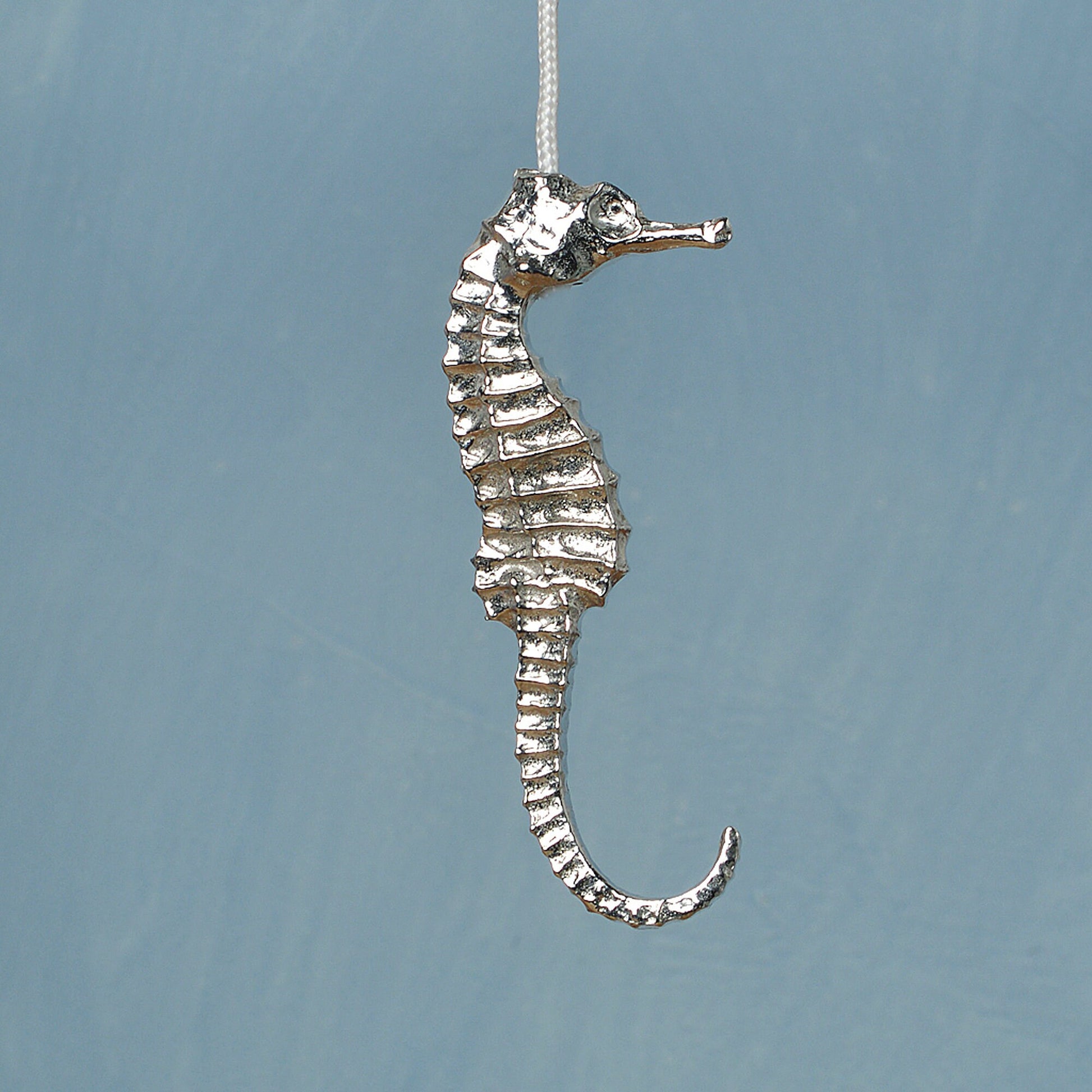 Seahorse bathroom light pull or cord pull. A tactile and decorative pewter seahorse hangs at the bottom of the bathroom light switch cord. ideal little housewarming gifts. Seahrse gifts for seahorse lovers.