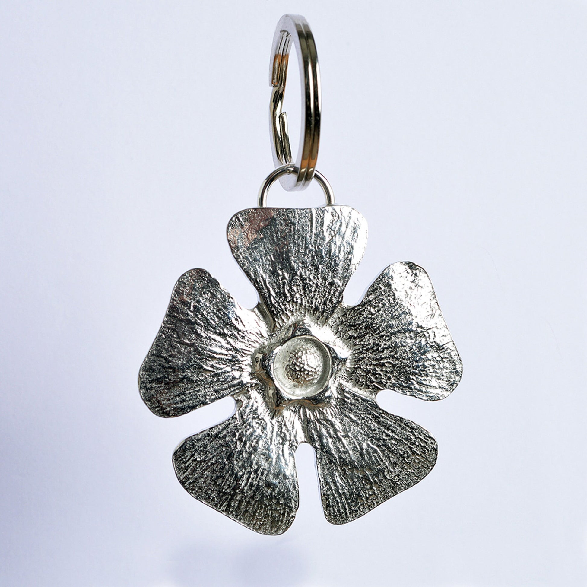 A solid pewter flower shaped keyring on a quality stainless steel ring. Love tokens, new home gifts, useful gifts, gifts for nature lovers, forget me not gifts, housewarming gifts, handmade in the UK