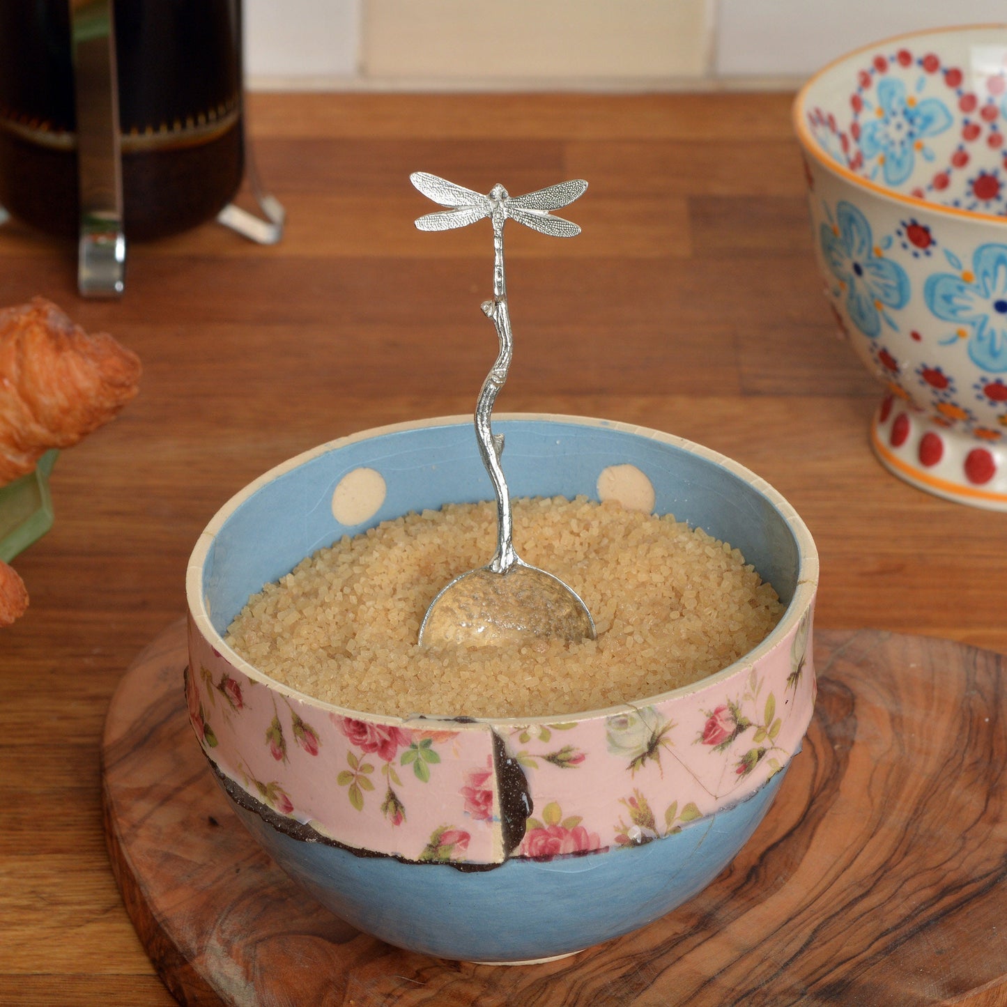 A small spoon pewter sugar spoon with a dragonfly on the end of a twig handle. Unusual, useful and tactile dragonfly gifts handmade in the UK