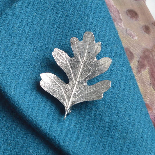 Hawthorn leaf pewter brooch, leaf jewellery gifts for her. Each hawthorn leaf brooch is 5.2cm (2.0 inches) tall and is attached with a metal clasp pin. Our hawthorn brooches make great gifts for nature lovers. UK handmade