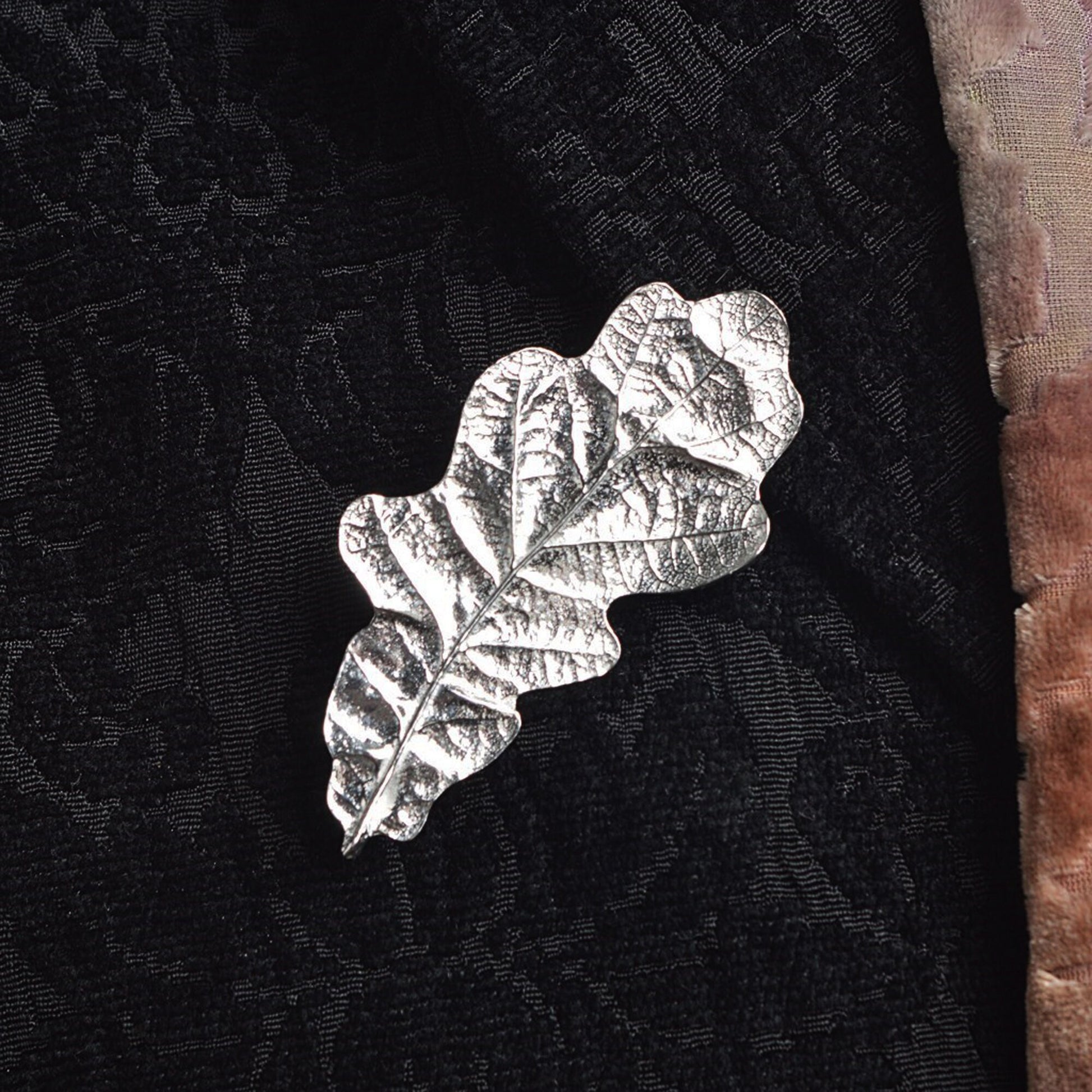 Beautifully detailed & textured oak leaf English pewter brooch, handmade in England. Oak leaf nature jewellery gifts for her. Each stunning pewter oak leaf brooch is 6.0cm (2.4 inches) tall and is attached with a metal clasp pin.