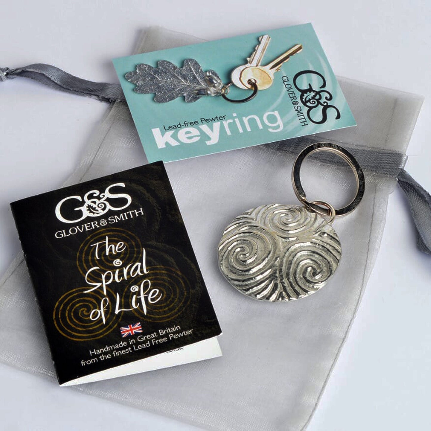 A detailed & pleasingly textured pewter Neolithic Spiral of Life relief keyring on a stainless steel ring. Triskelion key ring, spiral of life gifts, pewter keyring gifts. Housewarming gifts.