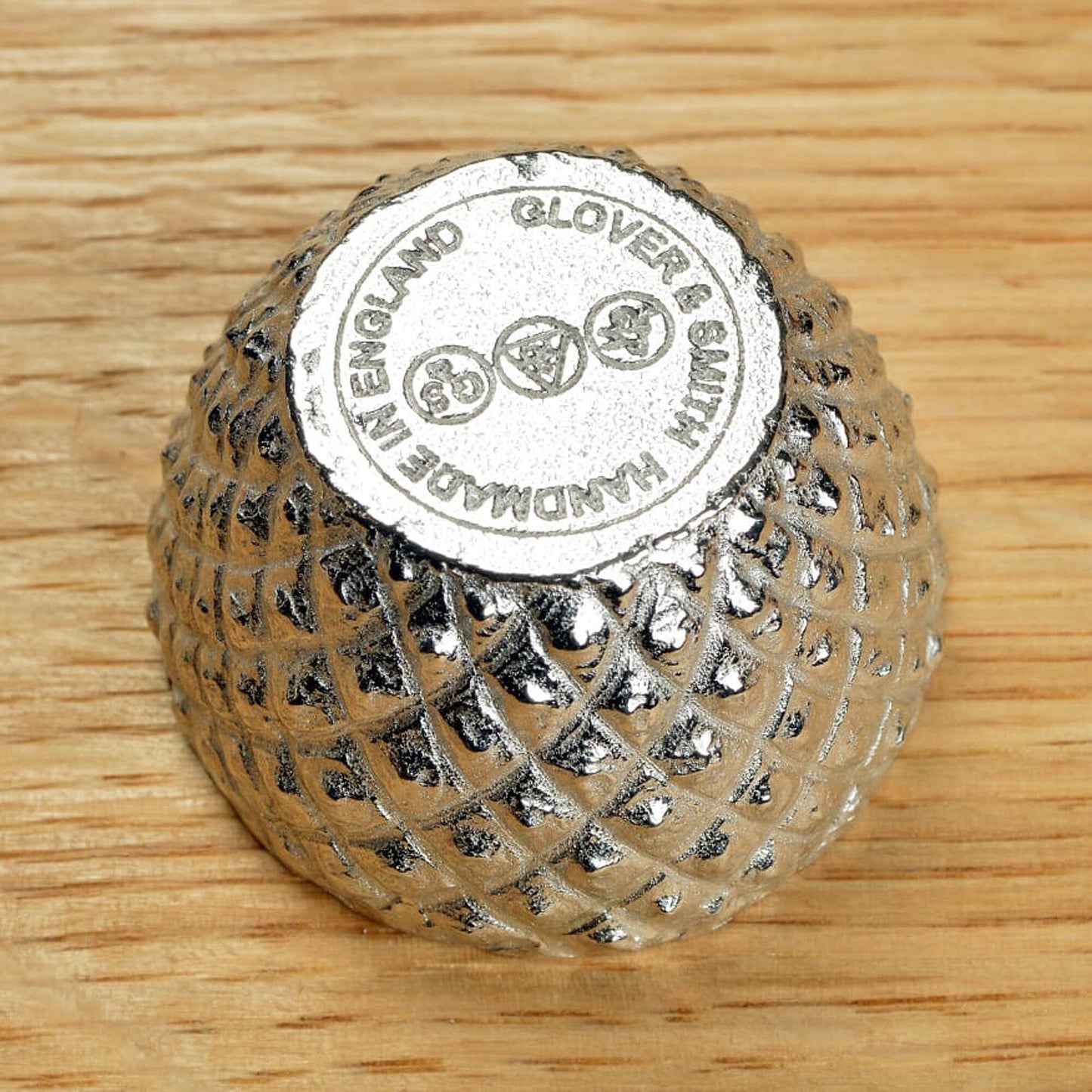 Our pewter 'Acorn Cup' egg cup features the lovely natural texture and pattern of an acorn cup and when an egg is placed in it, has the appearance of an acorn. With an oak leaf topped spoon. Christening gifts for boys and girls.