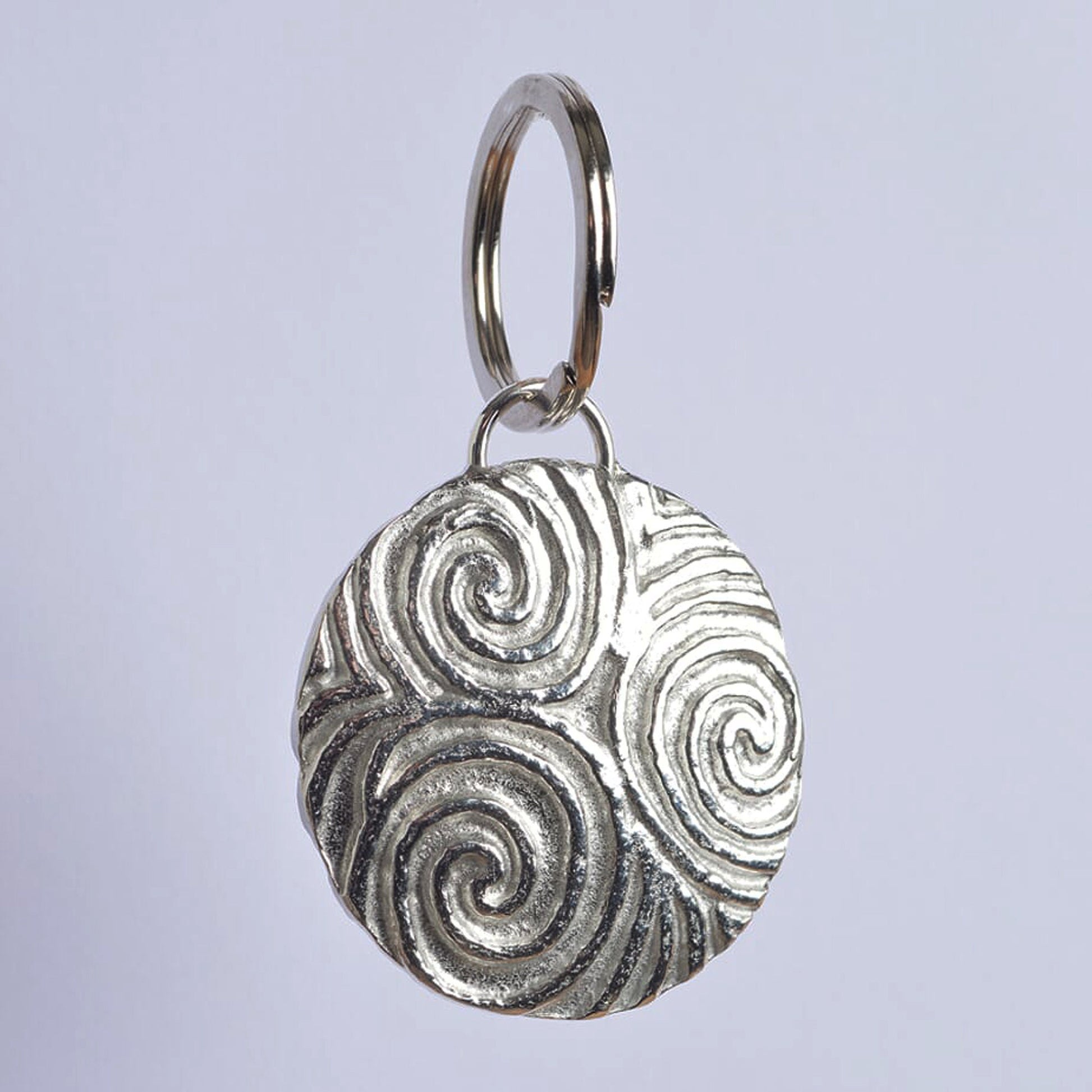 A detailed & pleasingly textured pewter Neolithic Spiral of Life relief keyring on a stainless steel ring. Triskelion key ring, spiral of life gifts, pewter keyring gifts. Housewarming gifts.