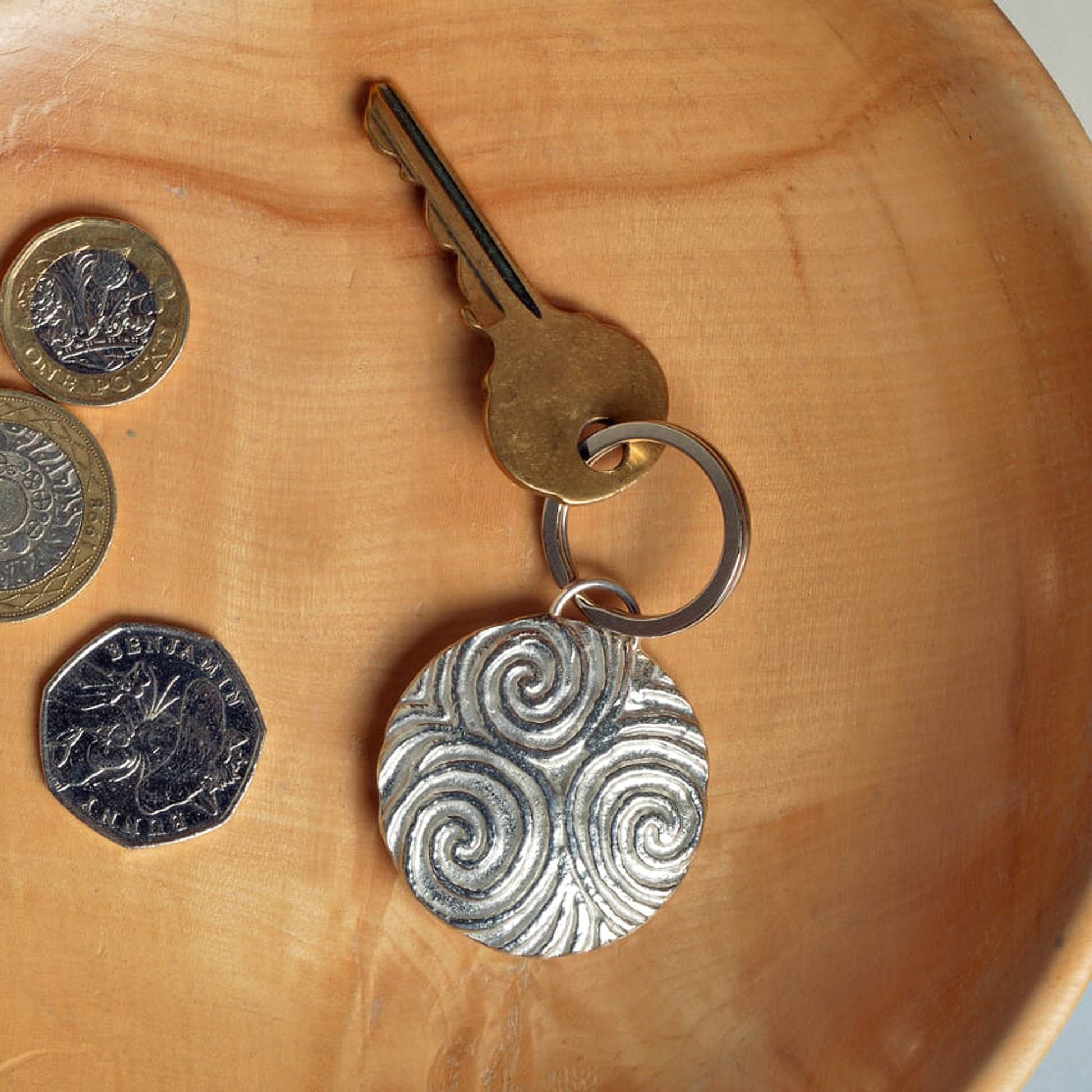 A detailed & pleasingly textured pewter Neolithic Spiral of Life relief keyring on a stainless steel ring. Triskelion key ring, spiral of life gifts, pewter keyring gifts. Housewarming gifts.