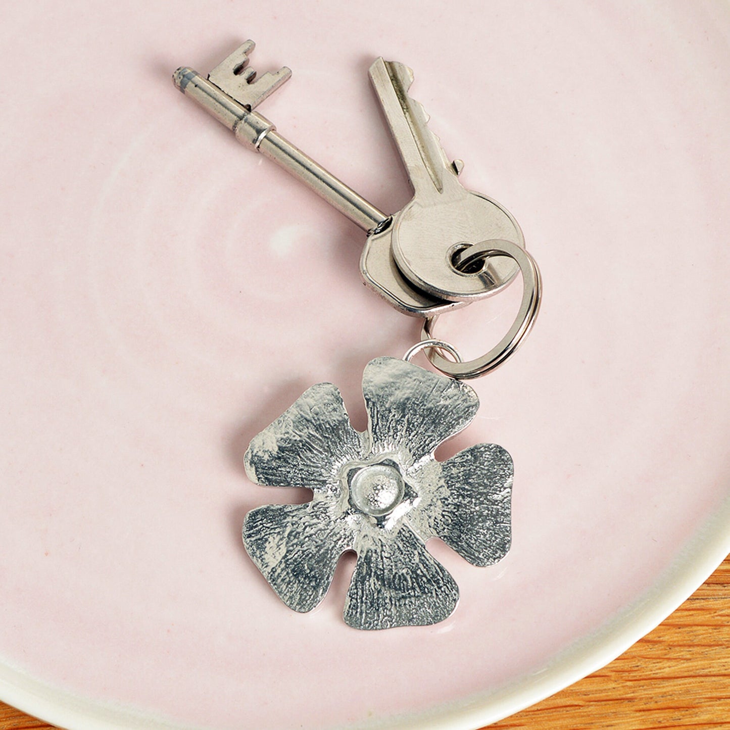 A solid pewter flower shaped keyring on a quality stainless steel ring. Love tokens, new home gifts, useful gifts, gifts for nature lovers, forget me not gifts, housewarming gifts, handmade in the UK