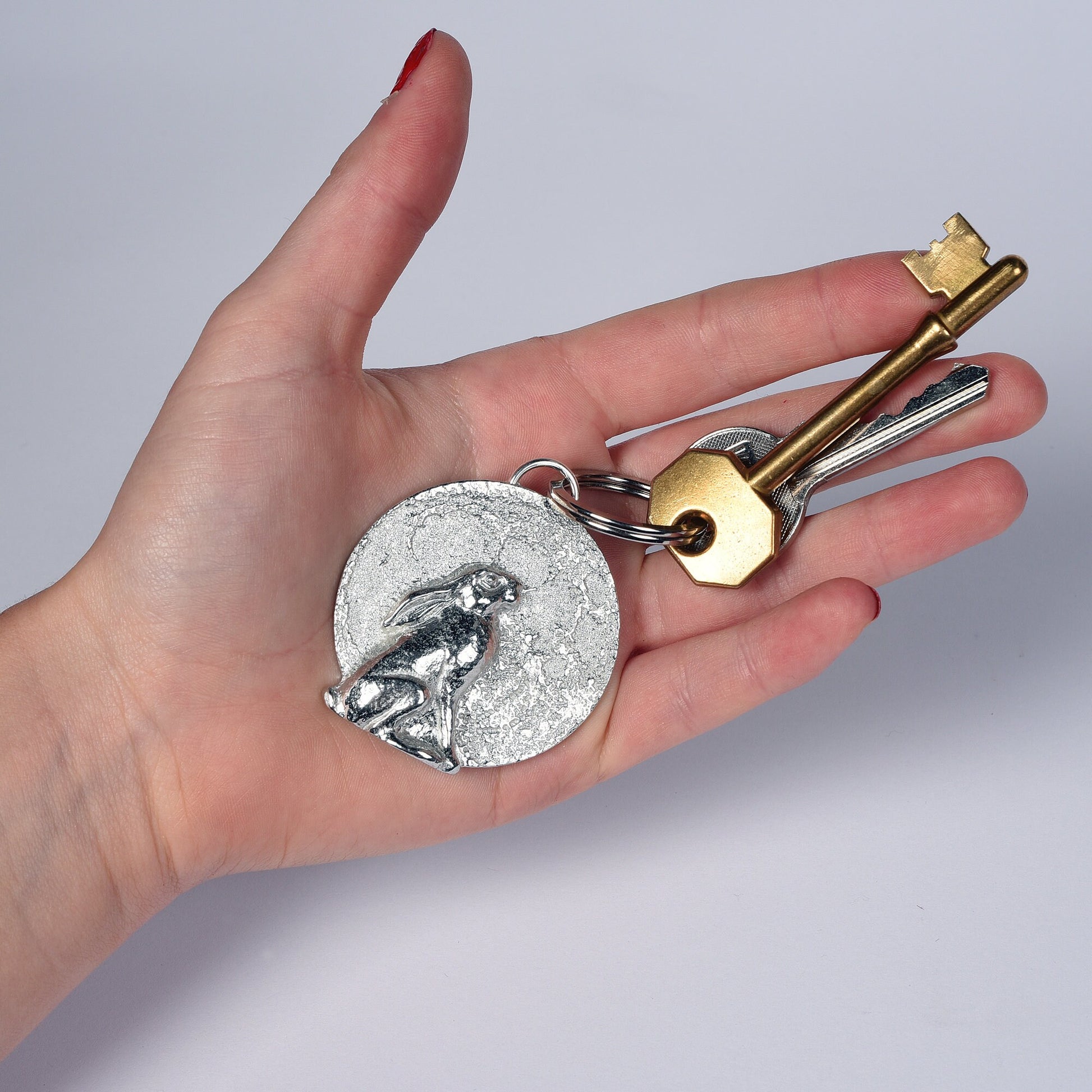 A hare gazes at a beautifully textured moon. Solid pewter hare keyring on a quality stainless steel ring. Hare gifts, gifts for hare lovers, Pewter keyring gifts. Housewarming gifts, moon staring hare keyring, moongazing hare gifts