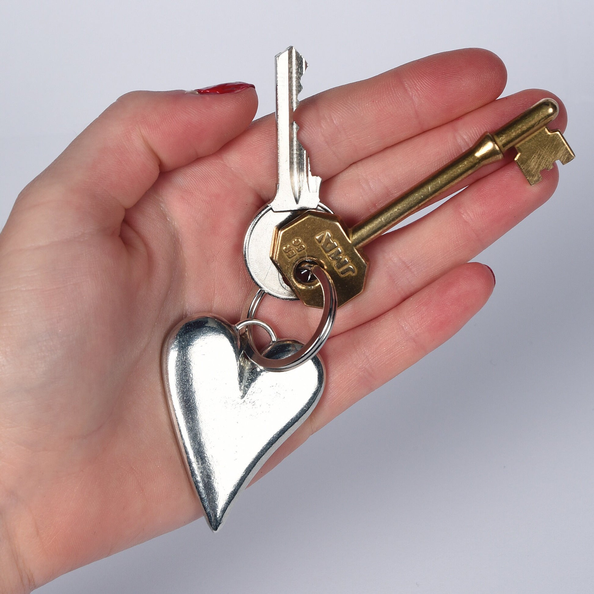 A solid pewter heart shaped keyring on a quality stainless steel ring. Love tokens, new home gifts, useful gifts, gifts for lovers, heart gifts, housewarming gifts, 10th tin ten year wedding anniversary gifts, small wedding gifts handmade in the UK