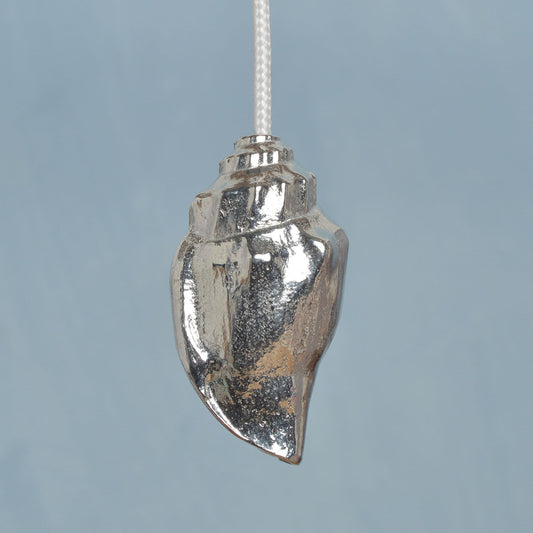 Sea shell bathroom light pull or cord pull. A tactile and decorative pewter sea shell hangs at the bottom of the bathroom light switch cord. ideal little housewarming gifts.