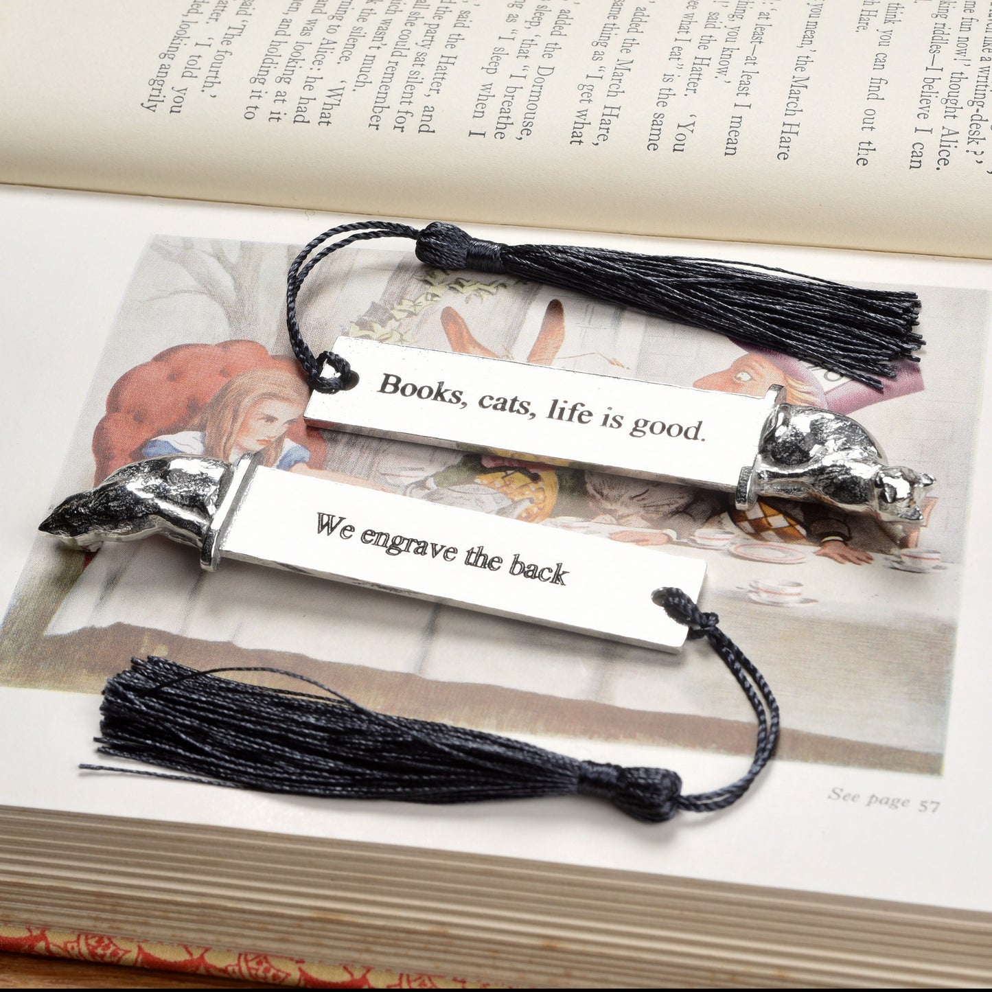 A personalised engraved pewter metal bookmark with a cat sculpture on the top. On the front the quotation 'Cats, books, life is good'. We engrave the back with your message. Gifts for cat lovers, book lovers gifts, cat gifts.