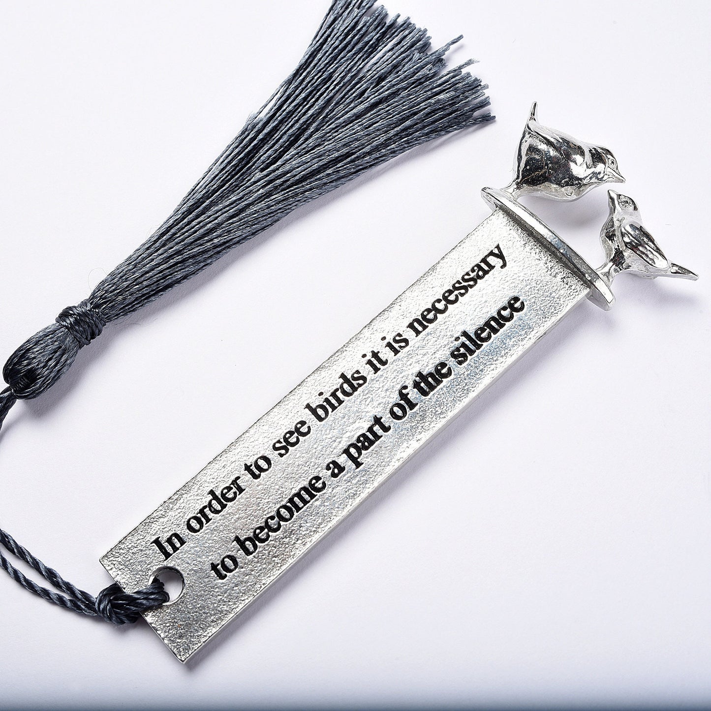 A personalised engraved pewter metal bookmark with a wren and a robin on the top. On the front the quotation 'In order to see birds it is necessary to become part of the silence'. We engrave the back with your message. Gifts for bird lovers, book lovers