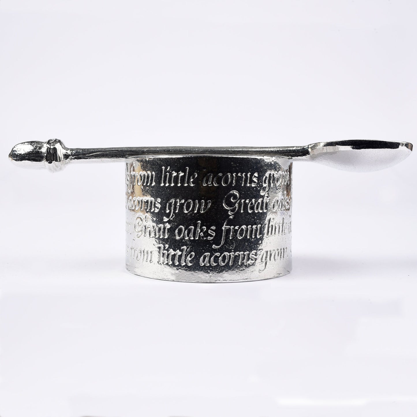 A circular egg cup with the proverb 'Great oaks from little acorns grow' written around the outside with an acorn finialled spoon. We engrave your message on the inside. Christening gifts for boys and girls.