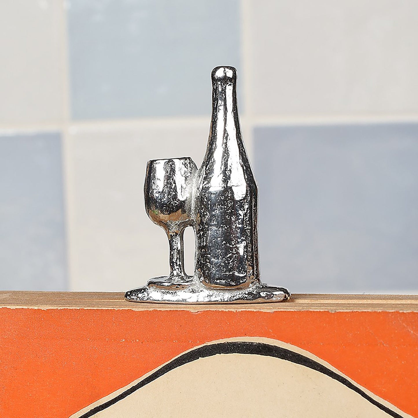 A personalised engraved pewter metal bookmark with a wine bottle and glass on the top. On the front the quotation 'Language is wine upon the lips'. We engrave the back with your message. Gifts for wine lovers, book lovers gifts.