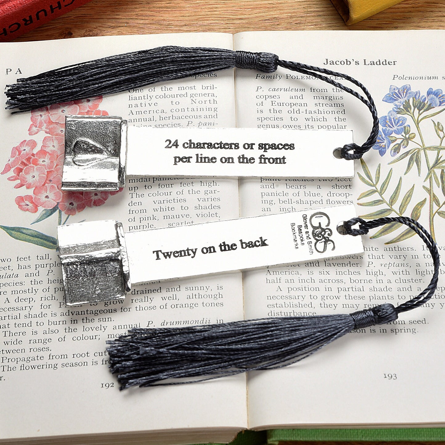 A personalised engraved pewter metal  bookmark with a heart on an open book on the top. We can engrave the front and the back with your own personalised messages. Unique gifts. Ideal 10th tin wedding anniversary gift. Our pewter is 95% tin.