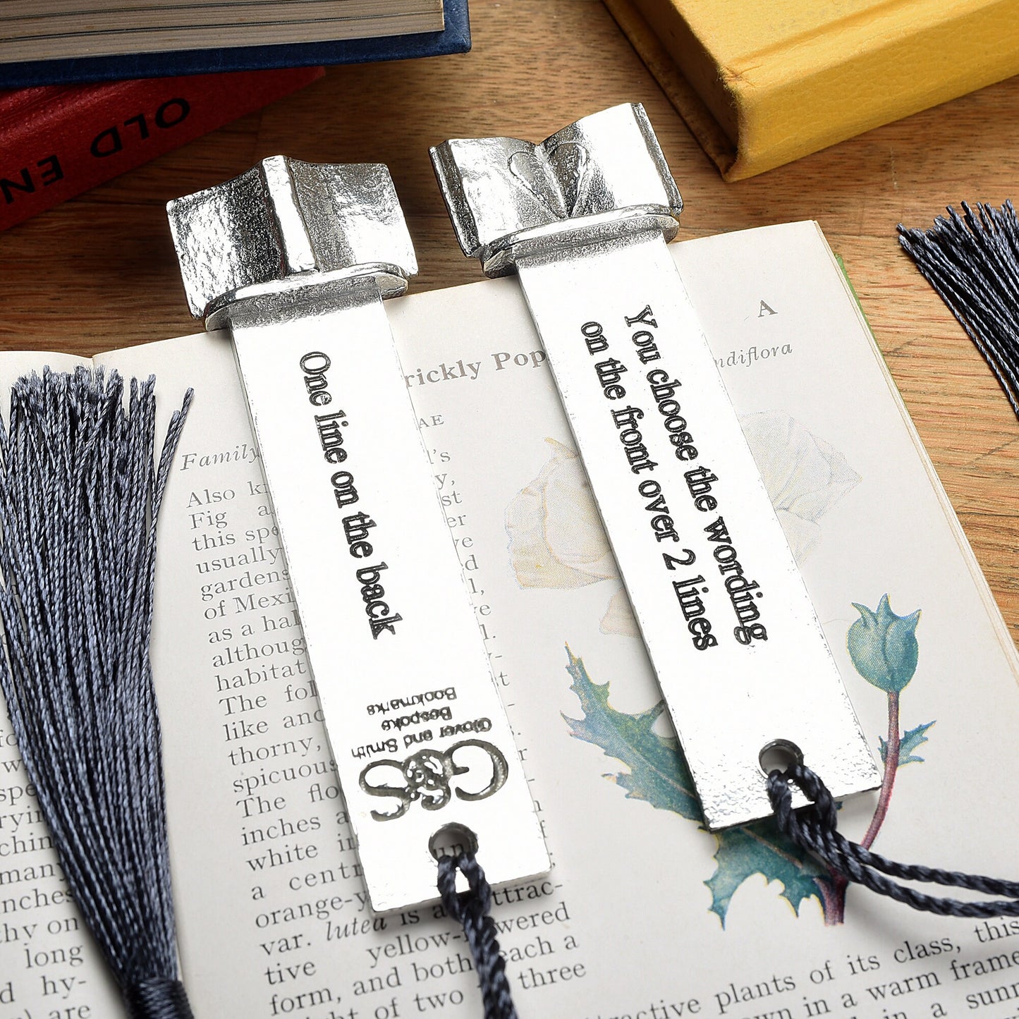 A personalised engraved pewter metal  bookmark with a heart on an open book on the top. We can engrave the front and the back with your own personalised messages. Unique gifts. Ideal 10th tin wedding anniversary gift. Our pewter is 95% tin.