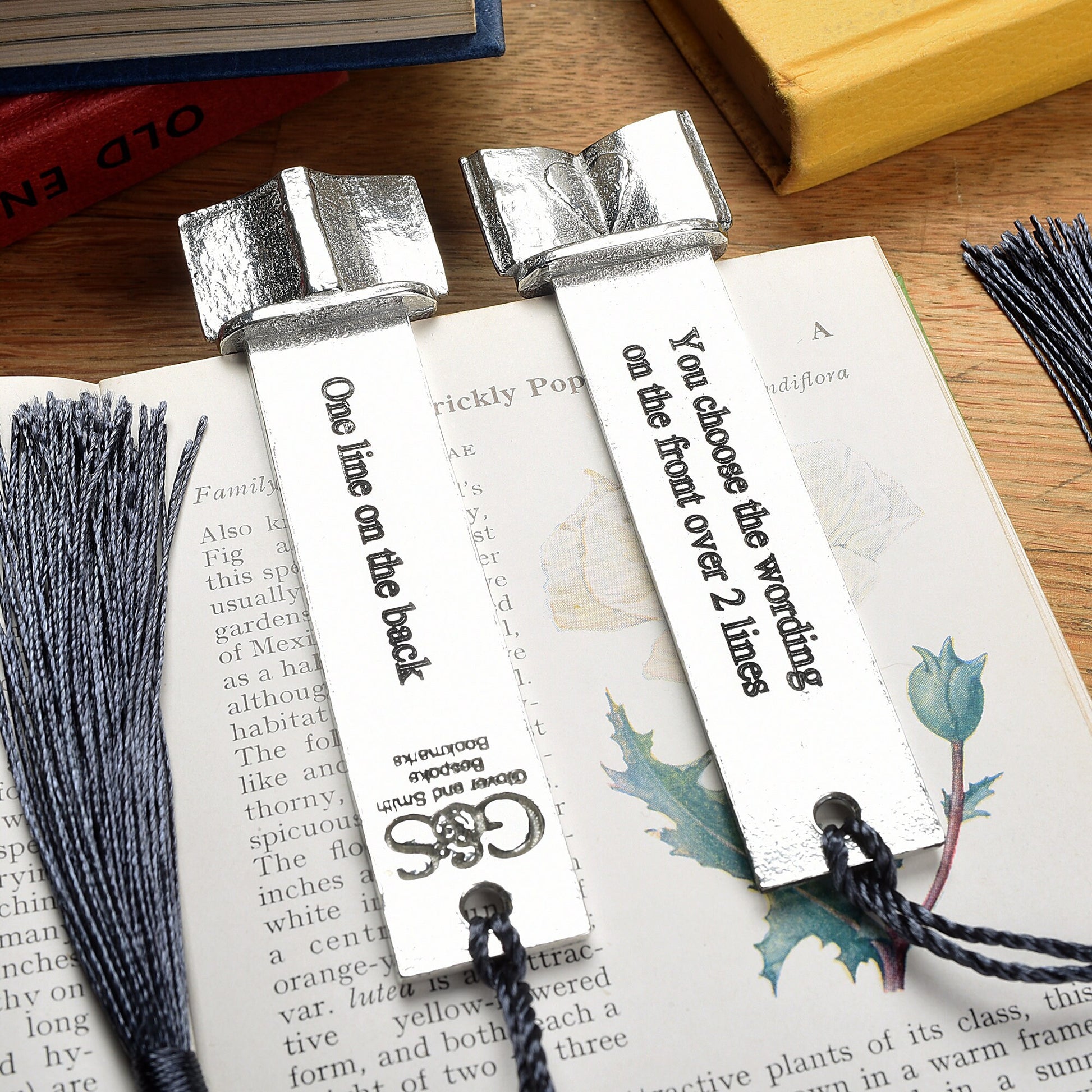 A personalised engraved pewter metal  bookmark with a heart on an open book on the top. We can engrave the front and the back with your own personalised messages. Unique gifts. Ideal 10th tin wedding anniversary gift. Our pewter is 95% tin.