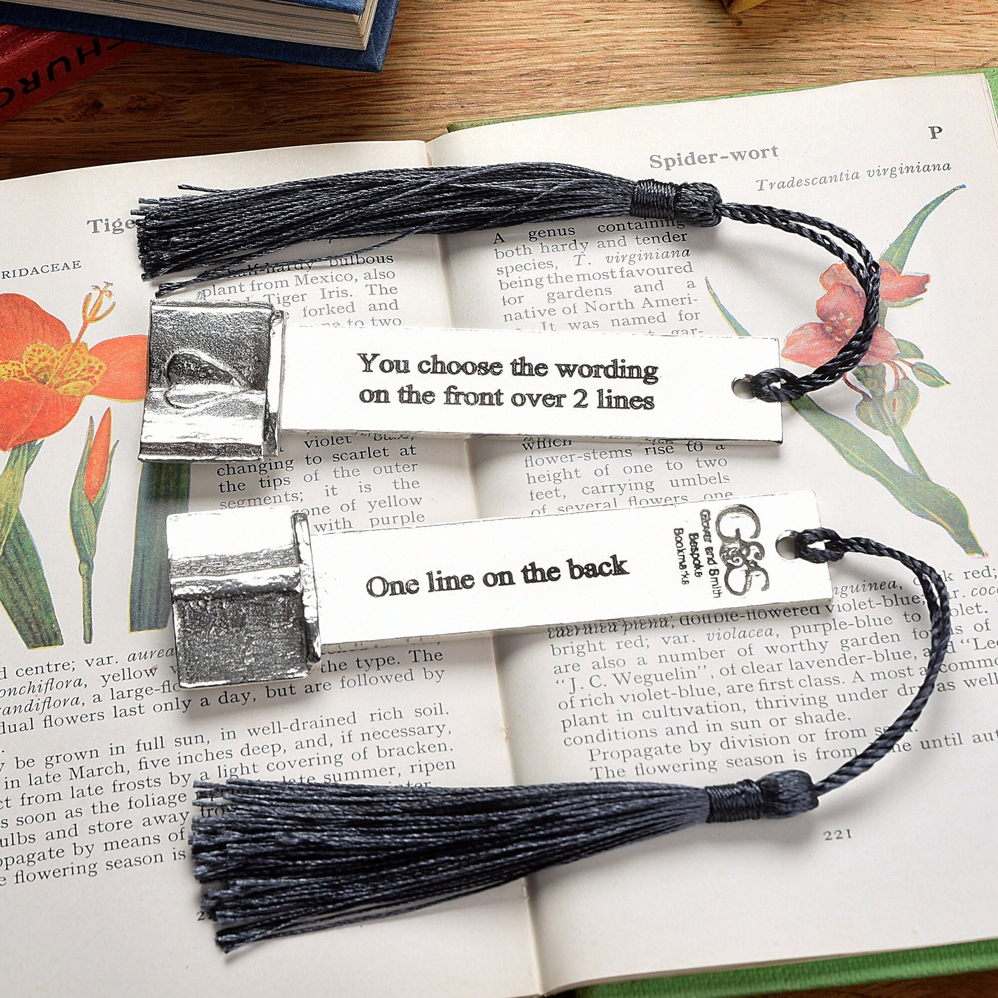 A personalised engraved pewter metal  bookmark with a heart on an open book on the top. We can engrave the front and the back with your own personalised messages. Unique gifts. Ideal 10th tin wedding anniversary gift. Our pewter is 95% tin.