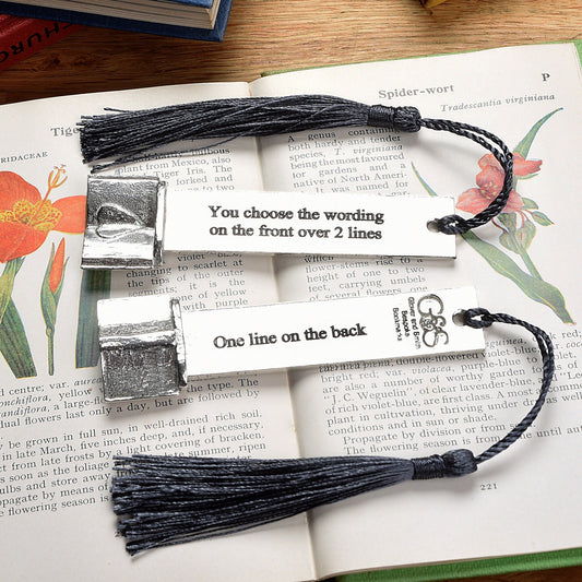 A personalised engraved pewter metal  bookmark with a heart on an open book on the top. We can engrave the front and the back with your own personalised messages. Unique gifts. Ideal 10th tin wedding anniversary gift. Our pewter is 95% tin.