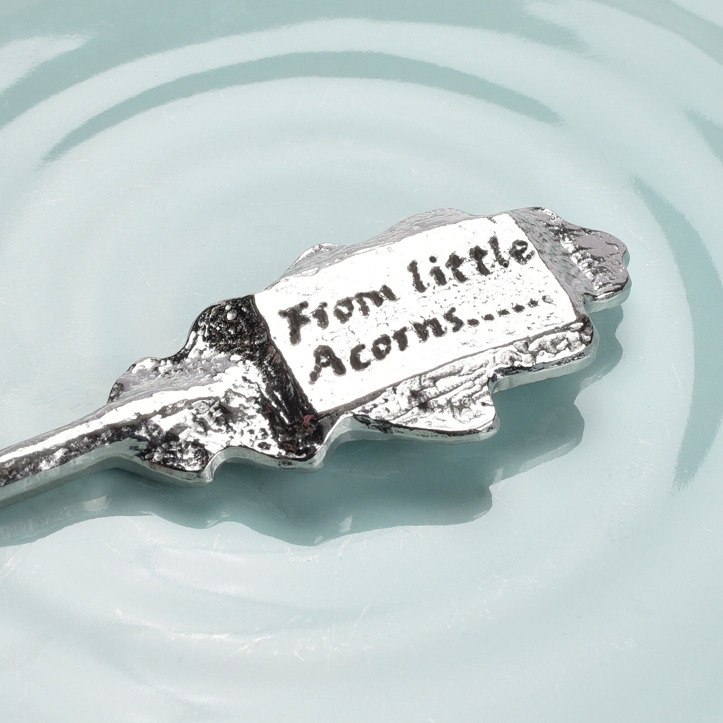 An oak leaf topped pewter spoon with the words 'From little acorns' on the reverse. Christening gifts for boys and girls. UK handmade.