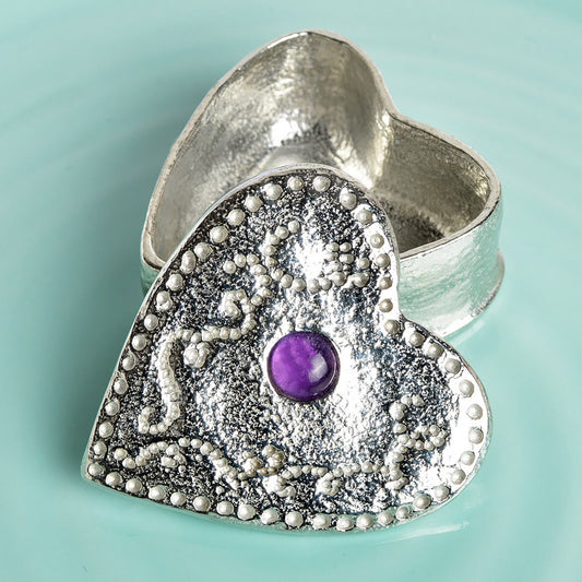 A personalised heart shaped pewter keepsake box has an amethyst stone in the middle. The underside of the lid can be engraved with your personalised message. A perfect 10th (Tin) ten year wedding anniversary gift (Our pewter is 95% tin).