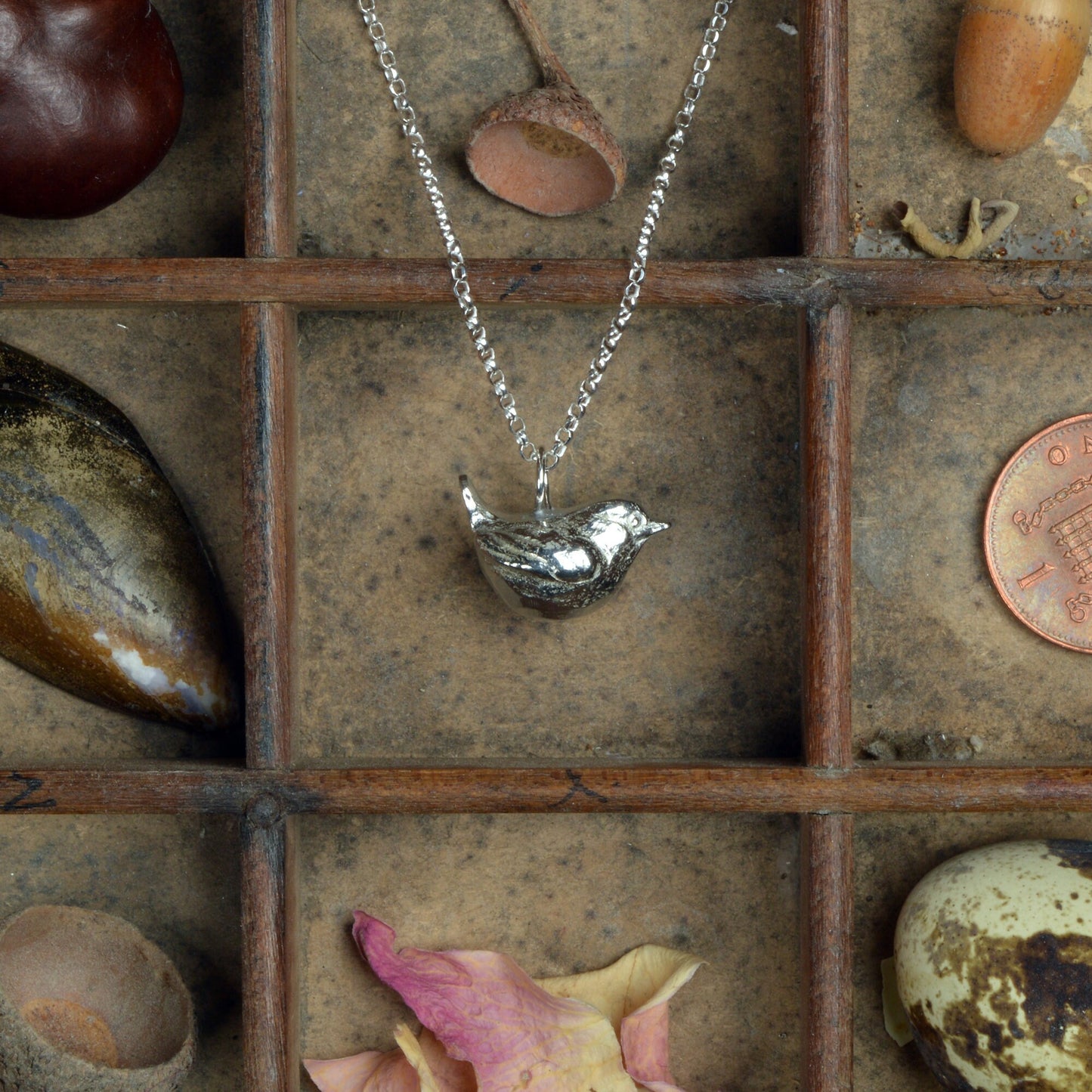 A delicate and detailed pewter wren bird necklace on an 18" Sterling silver chain. Great jewellery gifts for her, bird gifts for bird lovers. The perfect 10th tin 10 year wedding anniversary gift (Our pewter is 95% tin). Made in Britain with love.