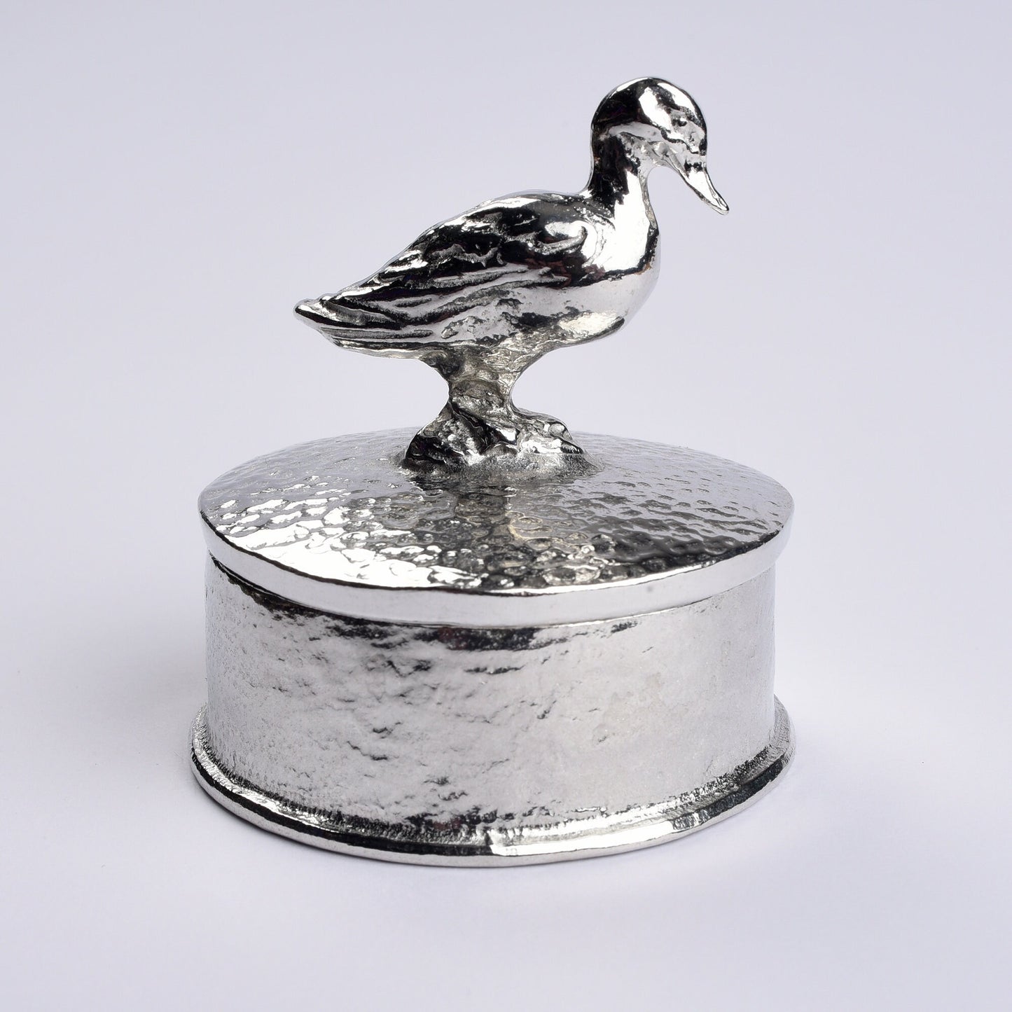 Duck pewter personalised trinket box. Our round  keepsake box features a duck sculpture as a handle. The underside of the lid can be engraved with your personalised message. A perfect 10th (Tin) ten year wedding anniversary gift (Our pewter is 95% tin)