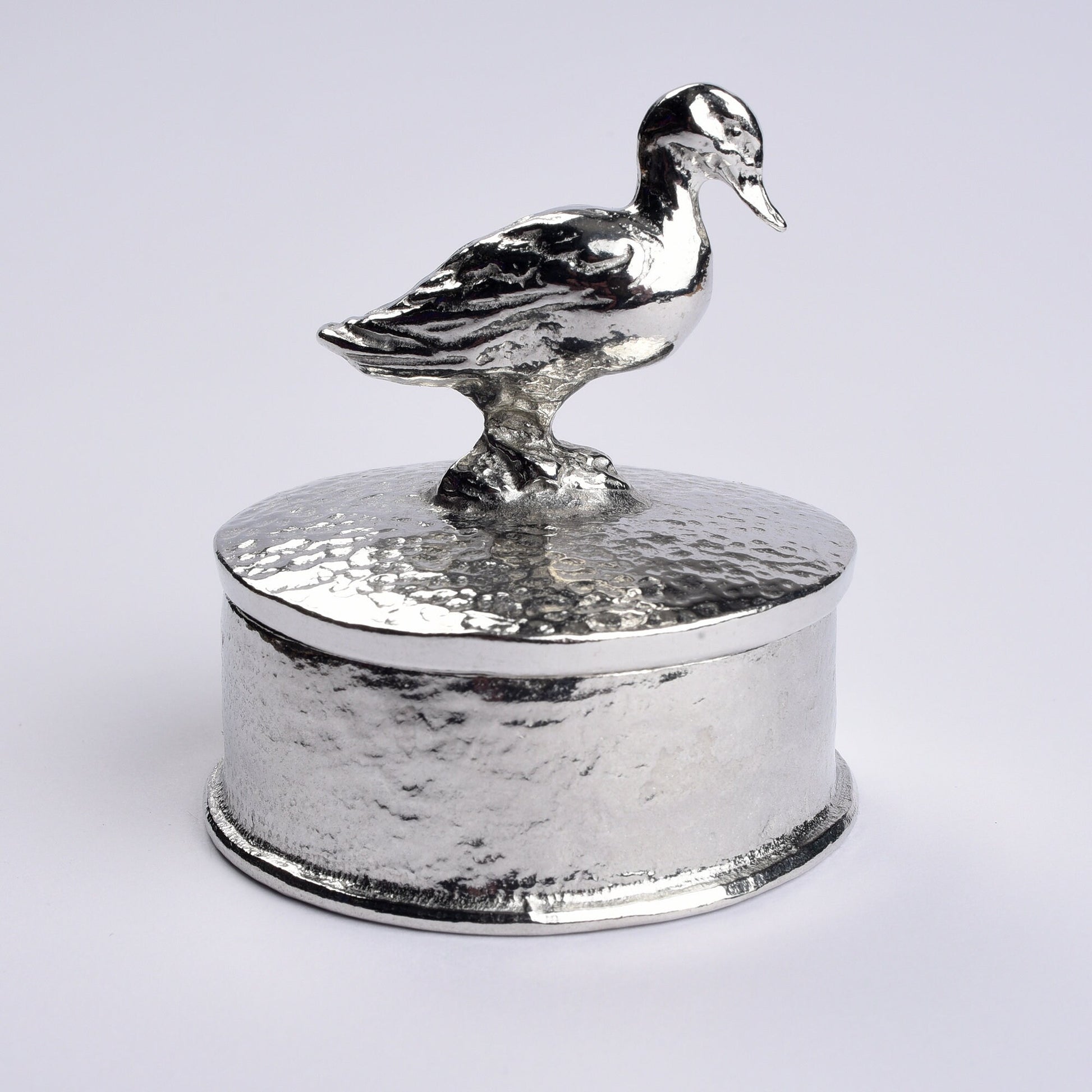 Duck pewter personalised trinket box. Our round  keepsake box features a duck sculpture as a handle. The underside of the lid can be engraved with your personalised message. A perfect 10th (Tin) ten year wedding anniversary gift (Our pewter is 95% tin)