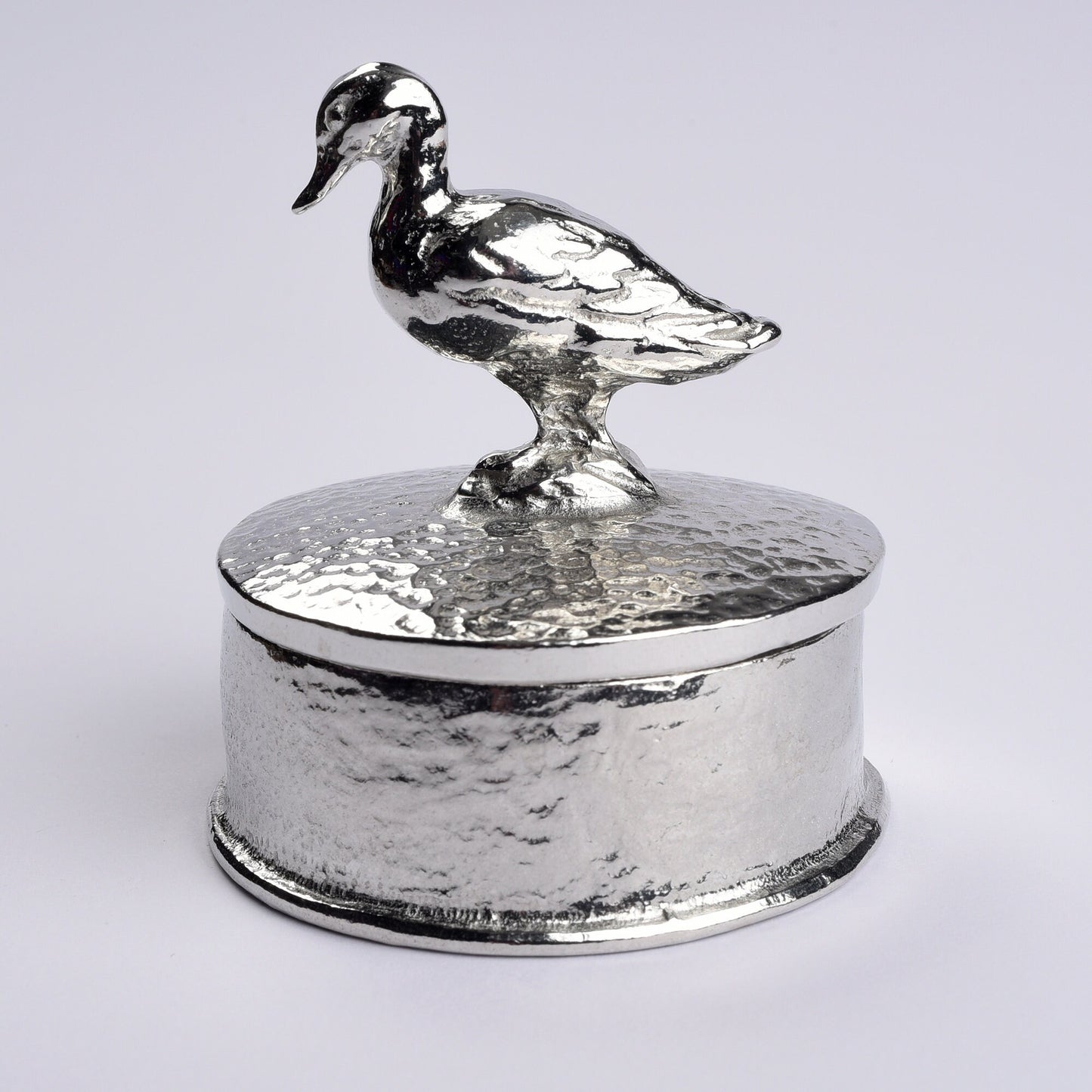 Duck pewter personalised trinket box. Our round  keepsake box features a duck sculpture as a handle. The underside of the lid can be engraved with your personalised message. A perfect 10th (Tin) ten year wedding anniversary gift (Our pewter is 95% tin)