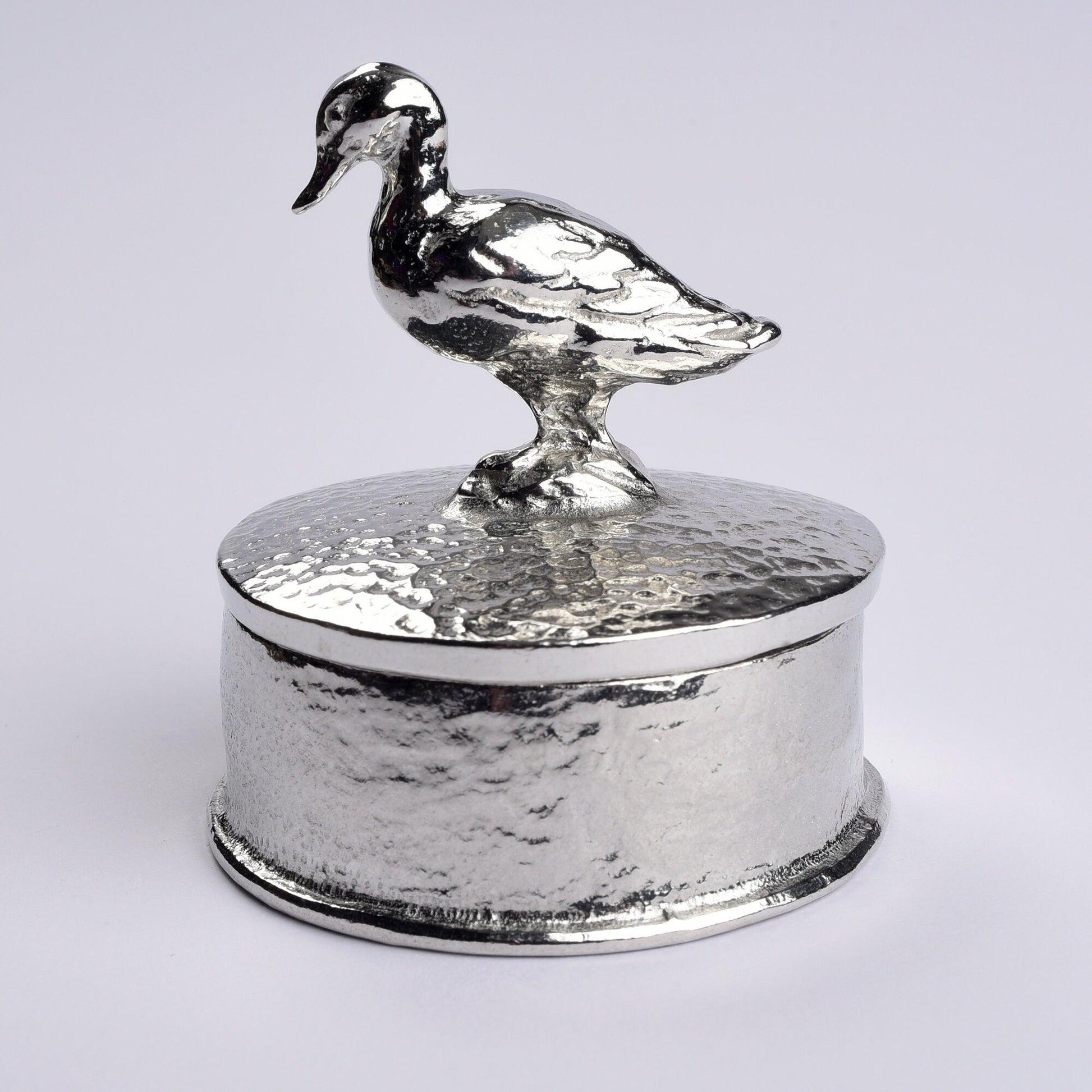 Duck pewter personalised trinket box. Our round  keepsake box features a duck sculpture as a handle. The underside of the lid can be engraved with your personalised message. A perfect 10th (Tin) ten year wedding anniversary gift (Our pewter is 95% tin)