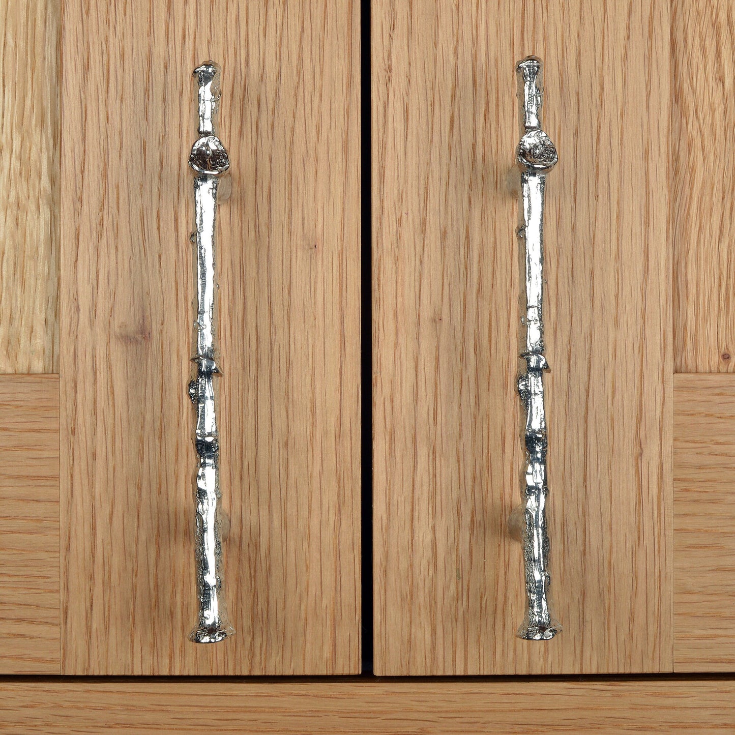 A solid pewter cabinet handle, cupboard knob, furniture handle or drawer pull in the shape of a detailed oak branch or twig. 96 mm between hole centres. Organic, unusual handles UK handmade with finesse