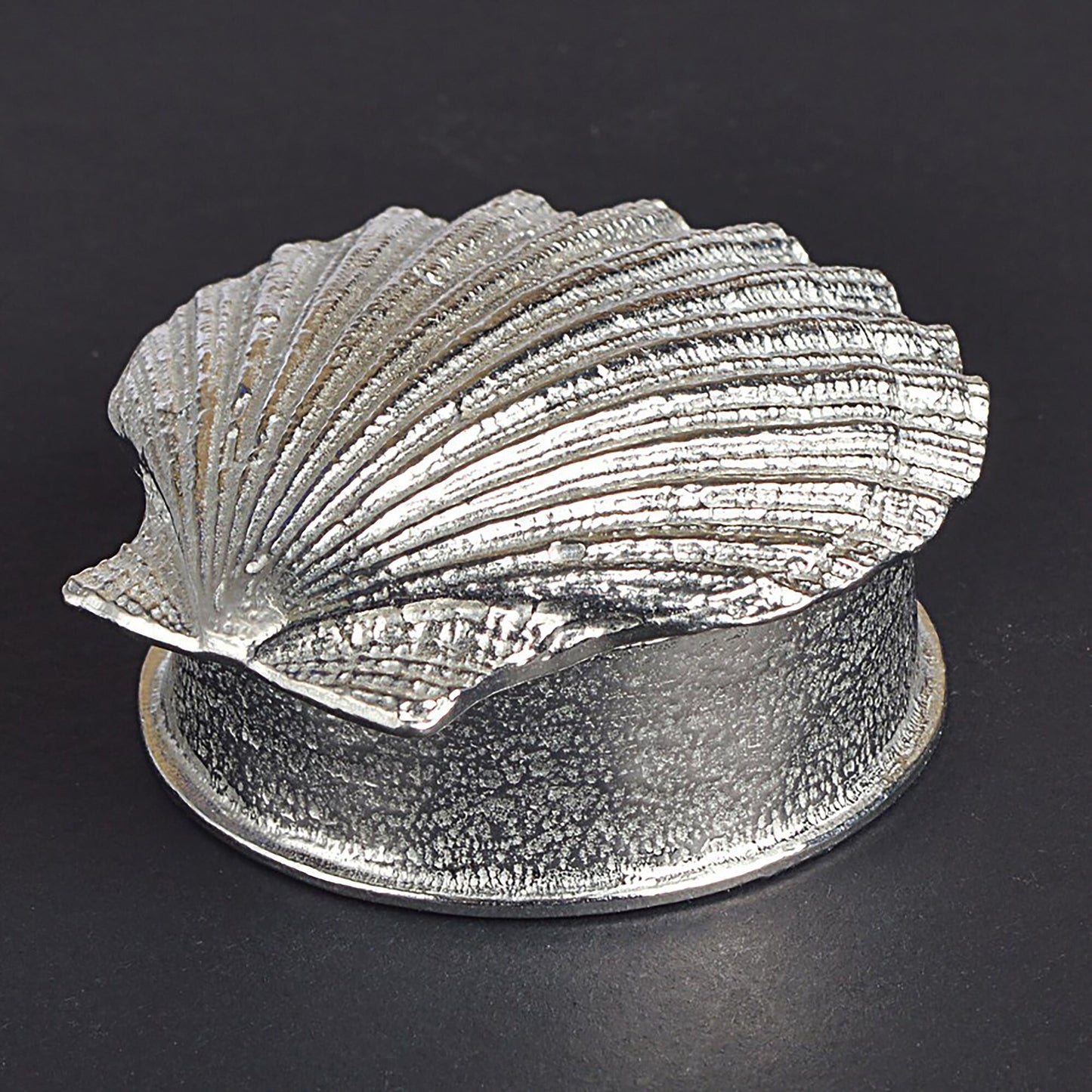 A round pewter trinket box with a scallop shell lid. Nautical gifts for lovers of the seaside and sea life.