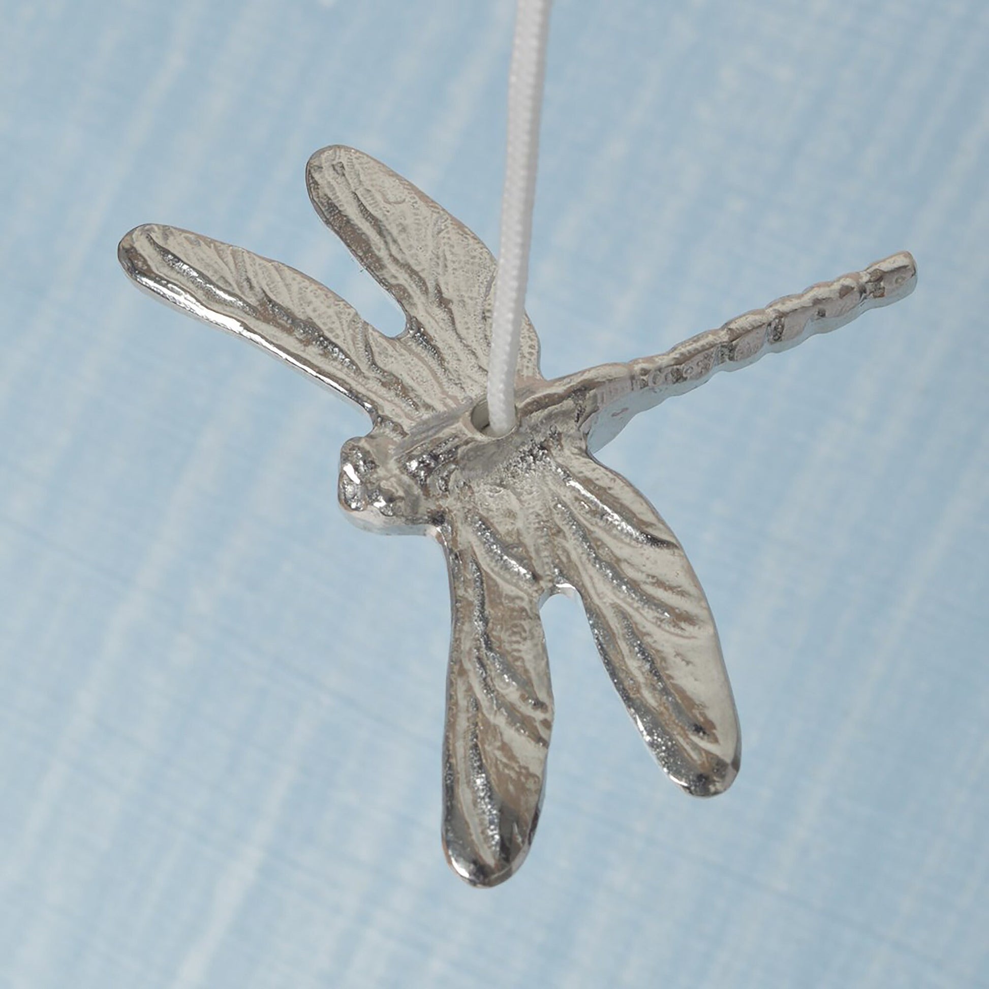 Dragonfly bathroom light pull or cord pull. A tactile and decorative pewter dragonfly hangs at the bottom of the bathroom light switch cord. ideal little housewarming gifts. Dragonfly gifts.