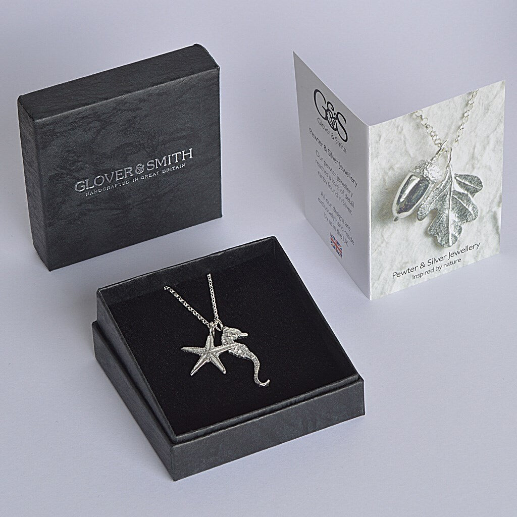A delicate and detailed pewter seahorse and starfish necklace on an 18" Sterling silver chain. Great jewellery gifts for her, nautical gifts for starfish and seahorse lovers. The perfect 10th tin 10 year wedding anniversary gift (Our pewter is 95% tin). Made in Britain with love.