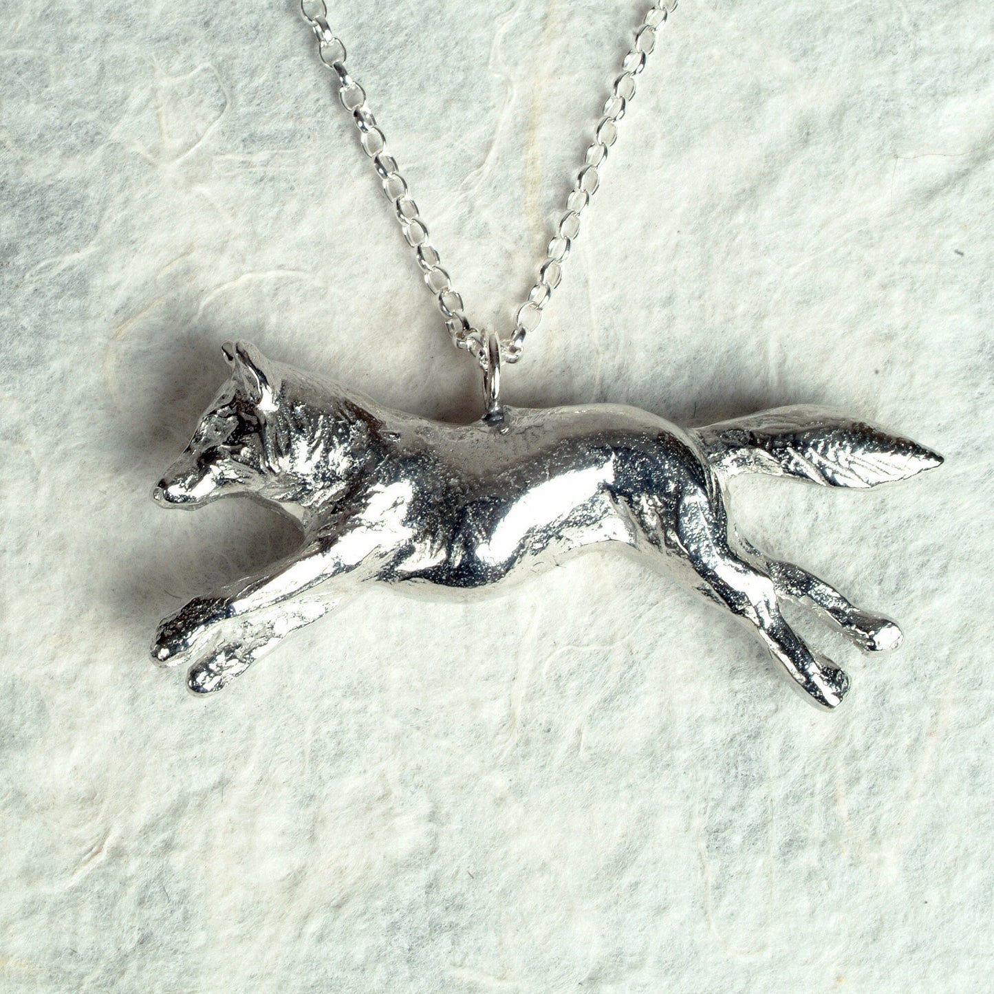 A detailed pewter running fox necklace on an 18" Sterling silver chain. Great jewellery gifts for her, fox gifts for fox lovers. Hunting gifts, country gifts. The perfect 10th tin 10 year wedding anniversary gift (Our pewter is 95% tin). Made in Britain with love.