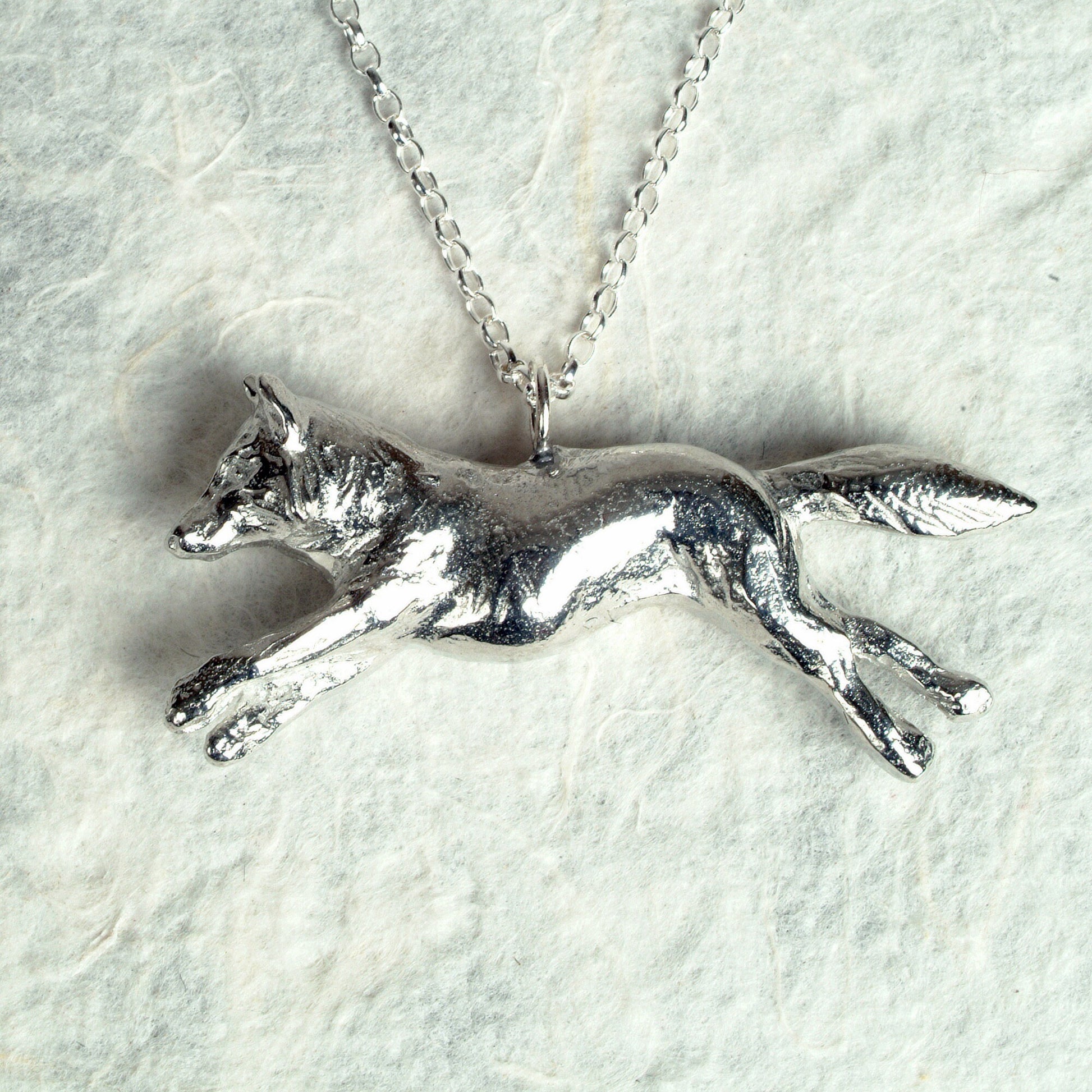 A detailed pewter running fox necklace on an 18" Sterling silver chain. Great jewellery gifts for her, fox gifts for fox lovers. Hunting gifts, country gifts. The perfect 10th tin 10 year wedding anniversary gift (Our pewter is 95% tin). Made in Britain with love.
