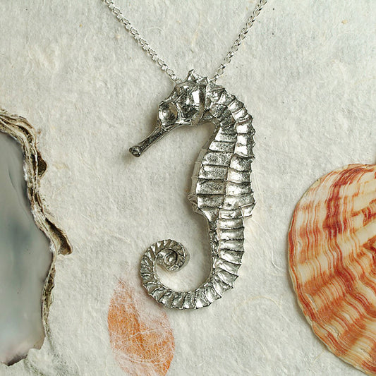 A delicate and detailed pewter seahorse necklace on an 18" Sterling silver chain. Great jewellery gifts for her, nautical gifts for seahorse lovers. The perfect 10th tin 10 year wedding anniversary gift (Our pewter is 95% tin). Made in Britain with love.