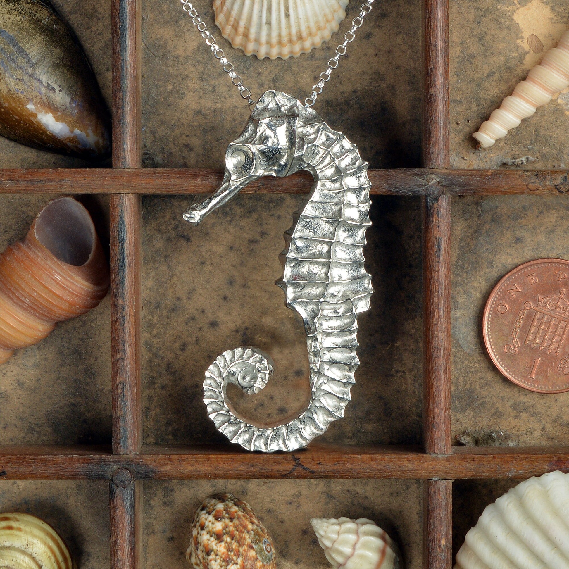 A delicate and detailed pewter seahorse necklace on an 18" Sterling silver chain. Great jewellery gifts for her, nautical gifts for seahorse lovers. The perfect 10th tin 10 year wedding anniversary gift (Our pewter is 95% tin). Made in Britain with love.