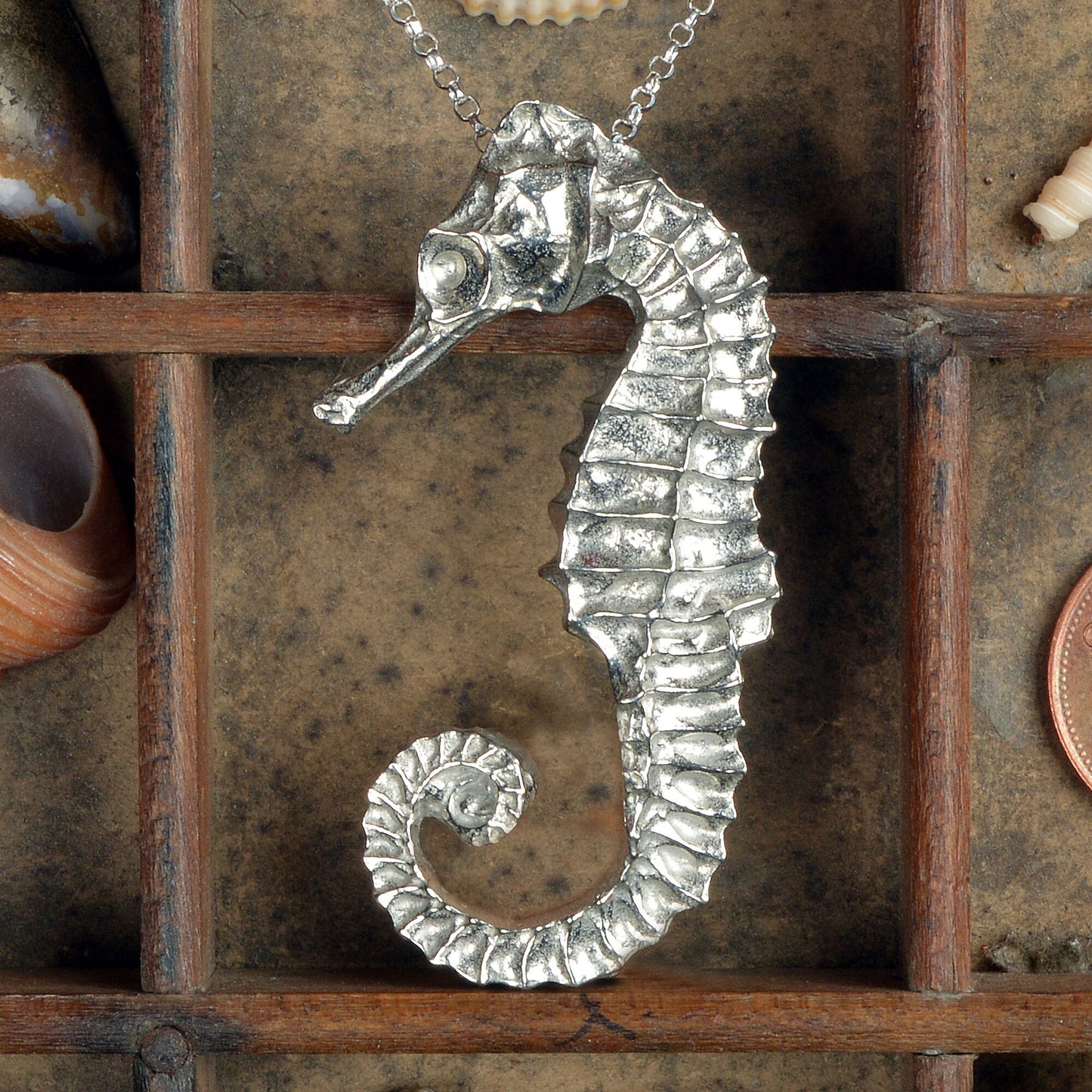 A delicate and detailed pewter seahorse necklace on an 18" Sterling silver chain. Great jewellery gifts for her, nautical gifts for seahorse lovers. The perfect 10th tin 10 year wedding anniversary gift (Our pewter is 95% tin). Made in Britain with love.