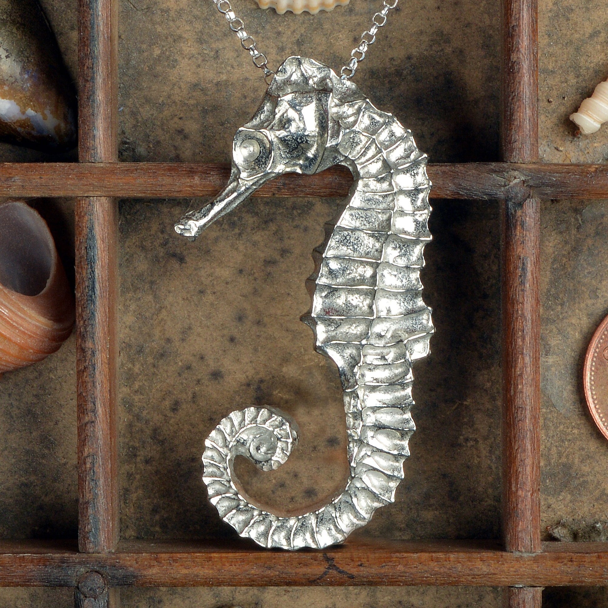 A delicate and detailed pewter seahorse necklace on an 18" Sterling silver chain. Great jewellery gifts for her, nautical gifts for seahorse lovers. The perfect 10th tin 10 year wedding anniversary gift (Our pewter is 95% tin). Made in Britain with love.